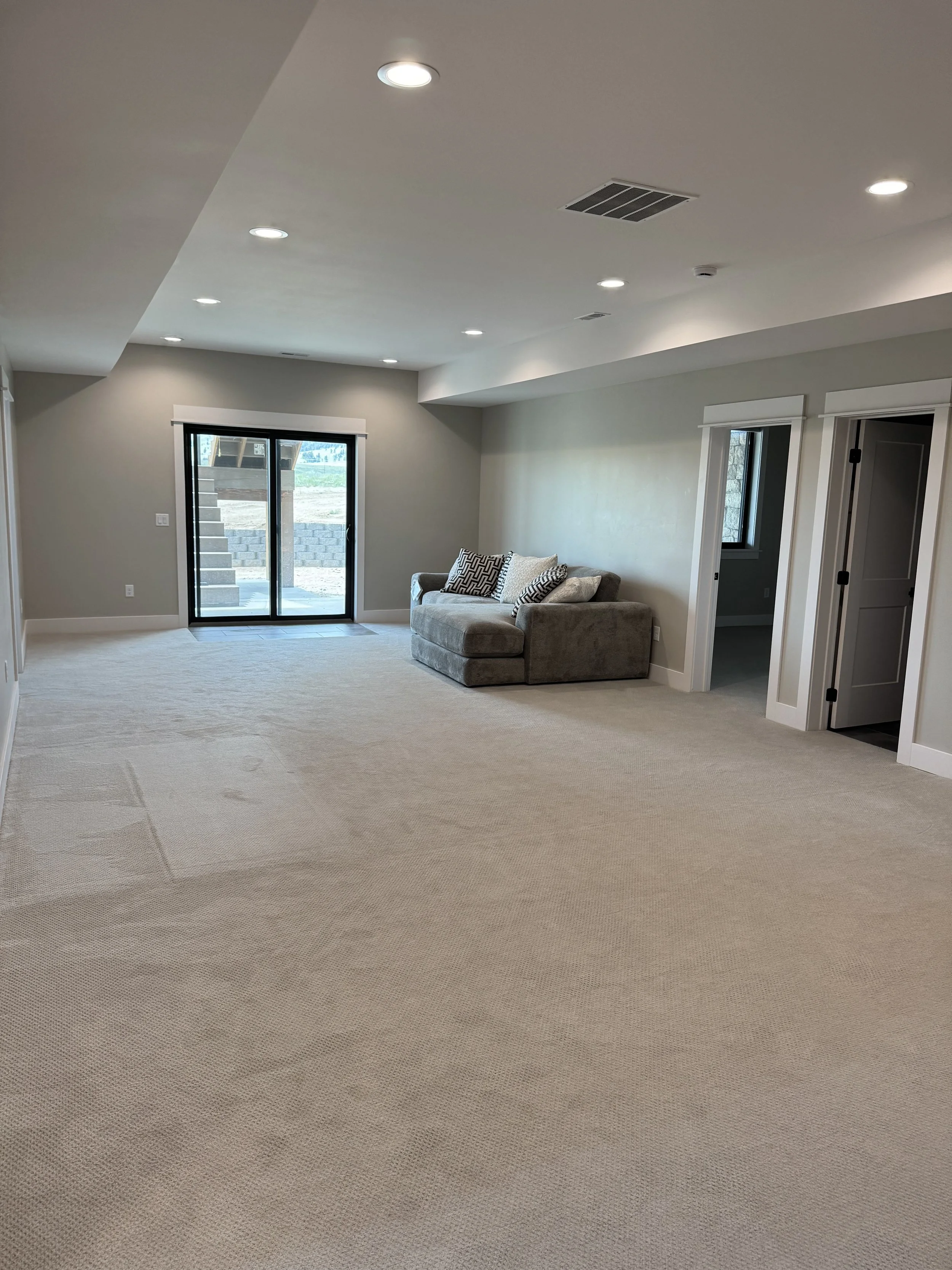 Spacious custom bedroom and living space with quality finishes — luxury Montana home builder Mihelich Custom Builders near Butte, MT.