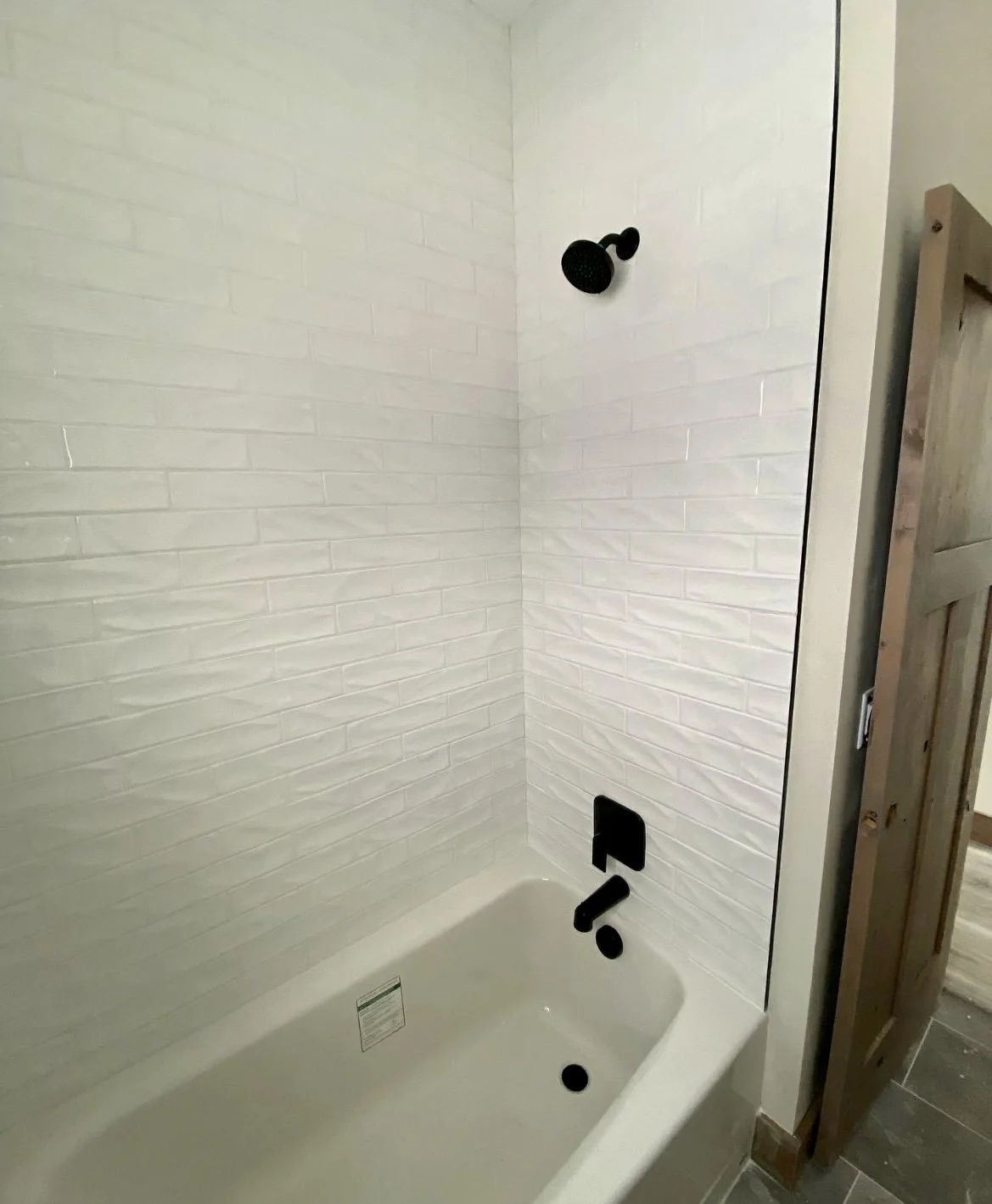 Custom interior millwork and finish details — high-end custom home shower and bath in Montana by Mihelich Custom Builders.