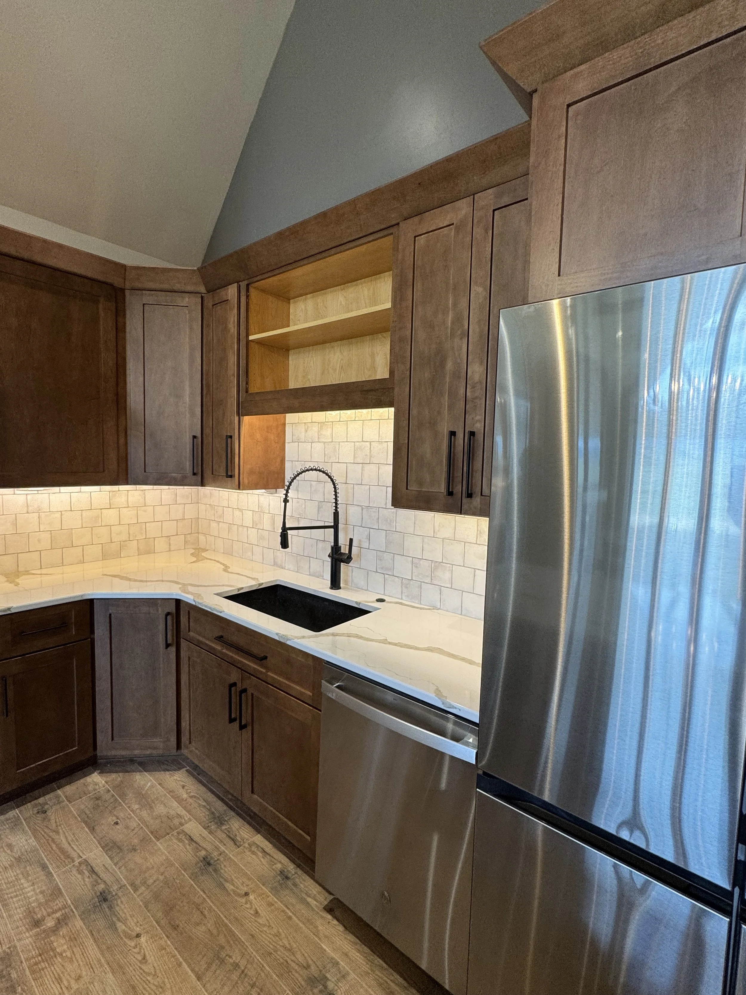 Custom kitchen with large center island and premium countertops — luxury Montana home builder Mihelich Custom Builders near Butte, MT.