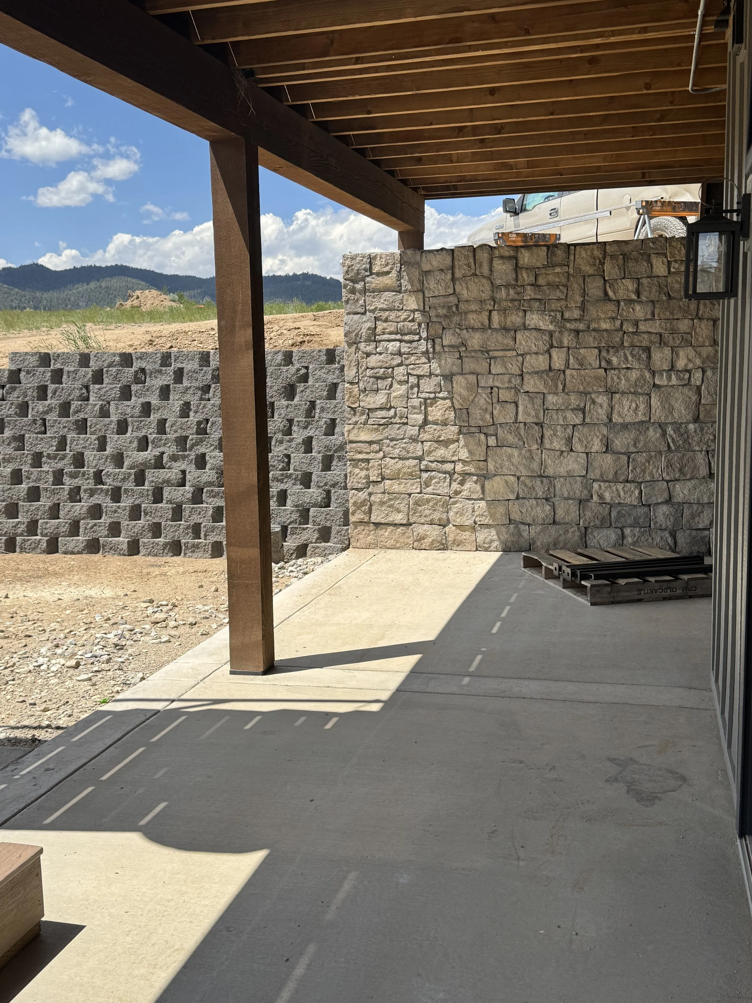 Custom stone exterior site work and landscaping detail — luxury Montana home builder Mihelich Custom Builders near Butte.