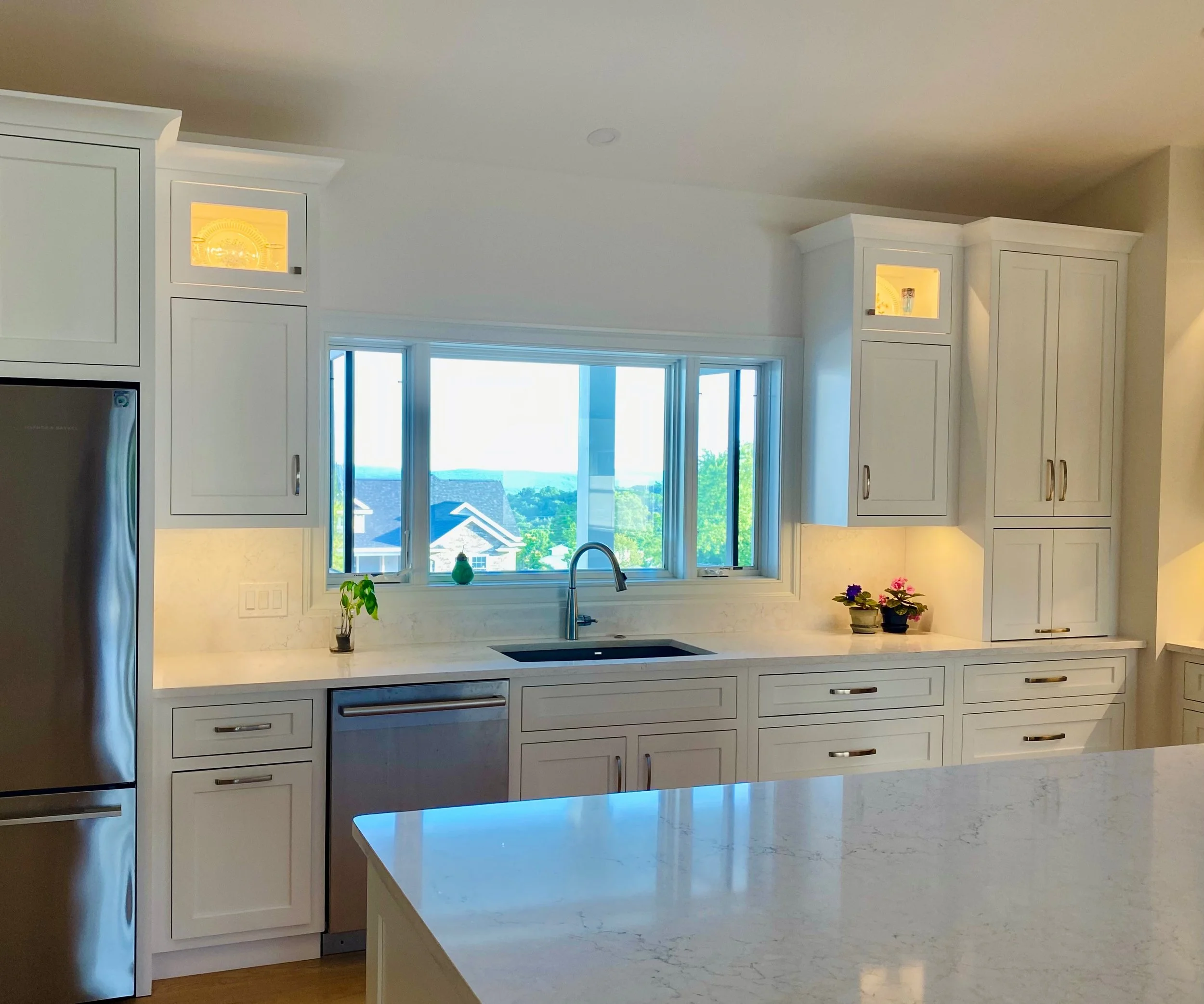 Kitchen design for new home in Endicott NY. Custom built painted white inset cabinetry with Cambria quartz countertops.