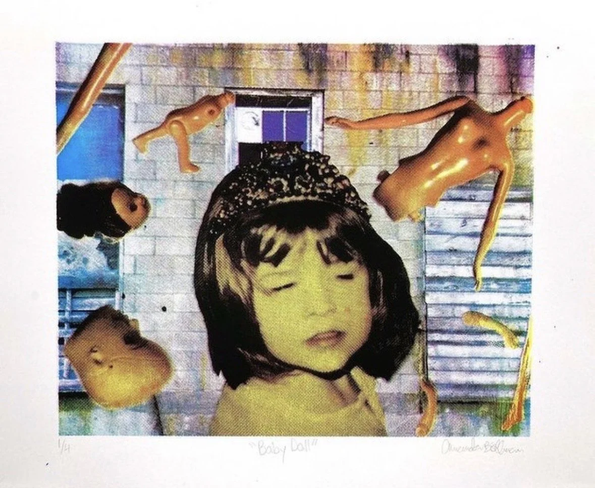 Mixed media artwork featuring a child's black-and-white photograph with messy bangs and a crown, set against an abstract background with plastic doll parts and doll faces.