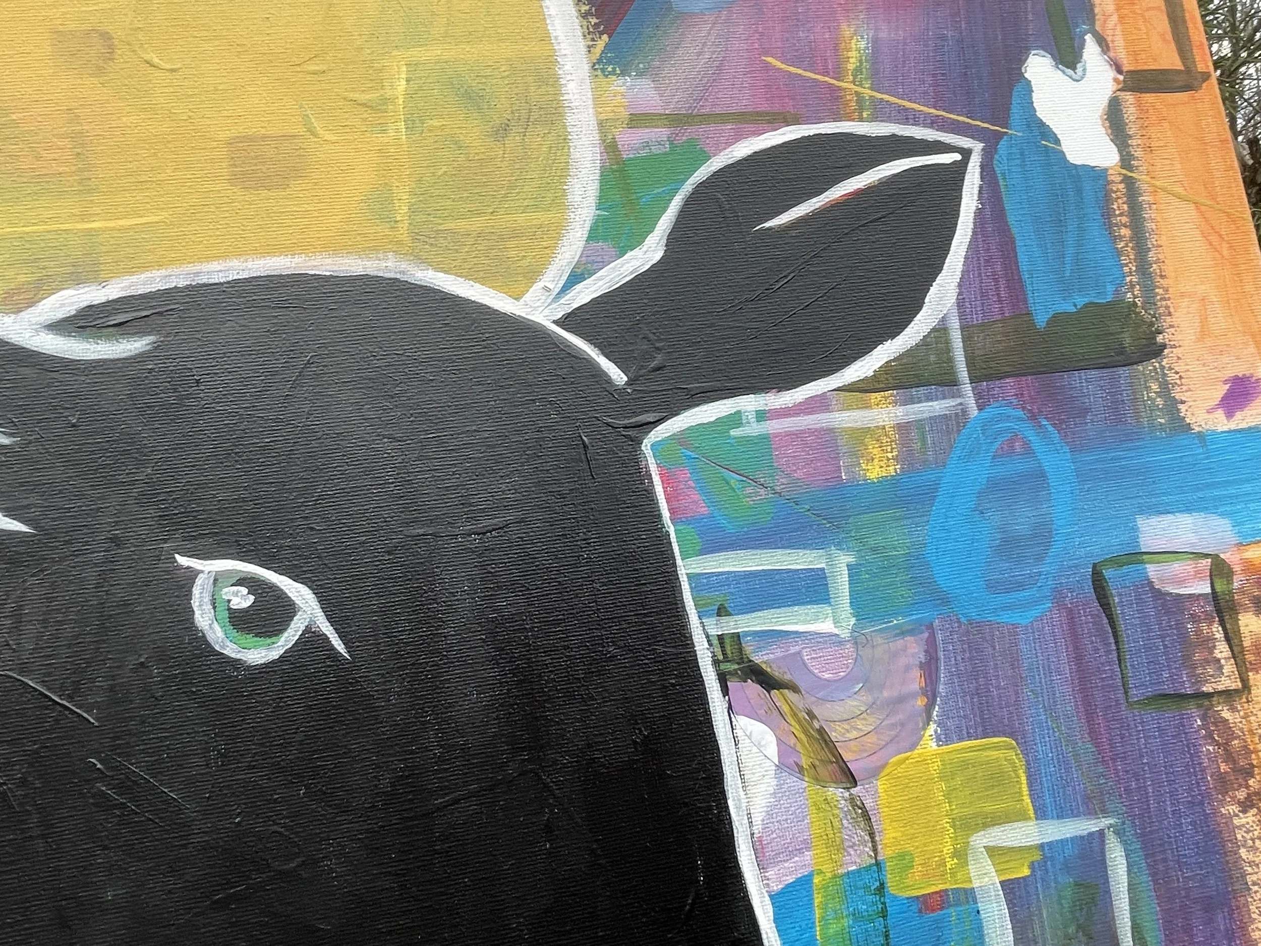 Close-up of a black cat illustration with green eye, set against a colorful abstract background.