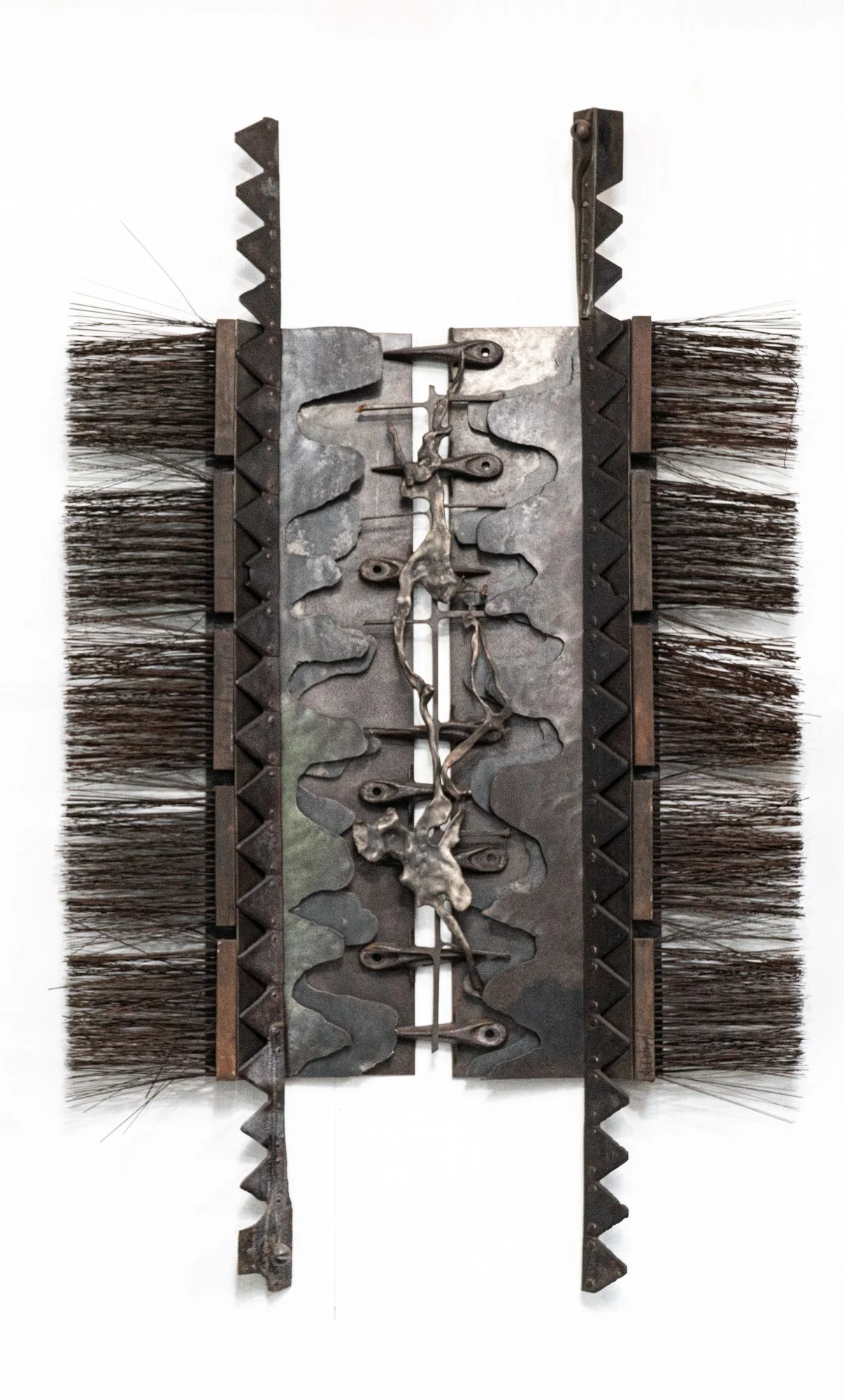 Innermost - Inspired by the absolute center or deepest level of a structure. Cast stainless steel, industrial brushes, welded steel. 5’5” x 40’ x 6”. 1993
