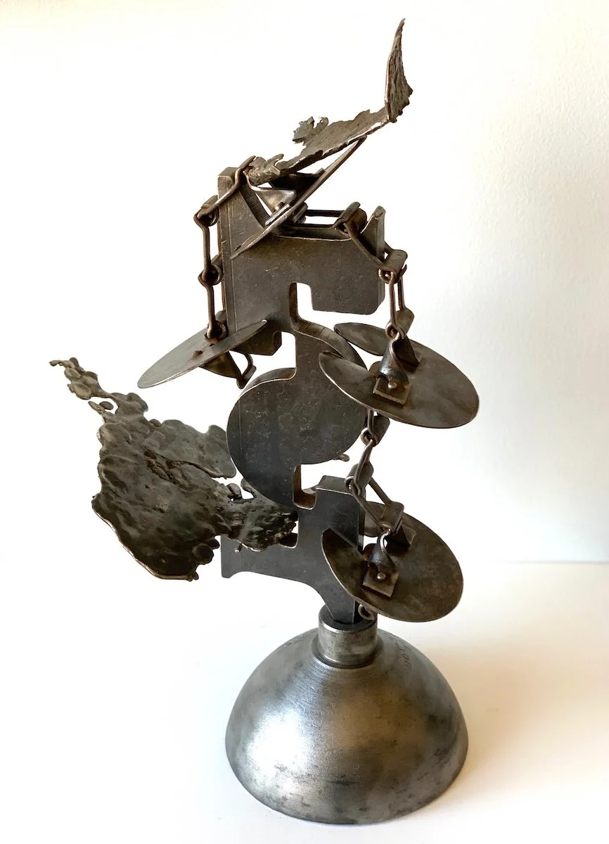 Cascade - The concept of a series of stages where each stage triggers the next. Vintage paddle conveyer, tank top, steel, cast stainless steel. 24.25” x 14” x 8”. 2021