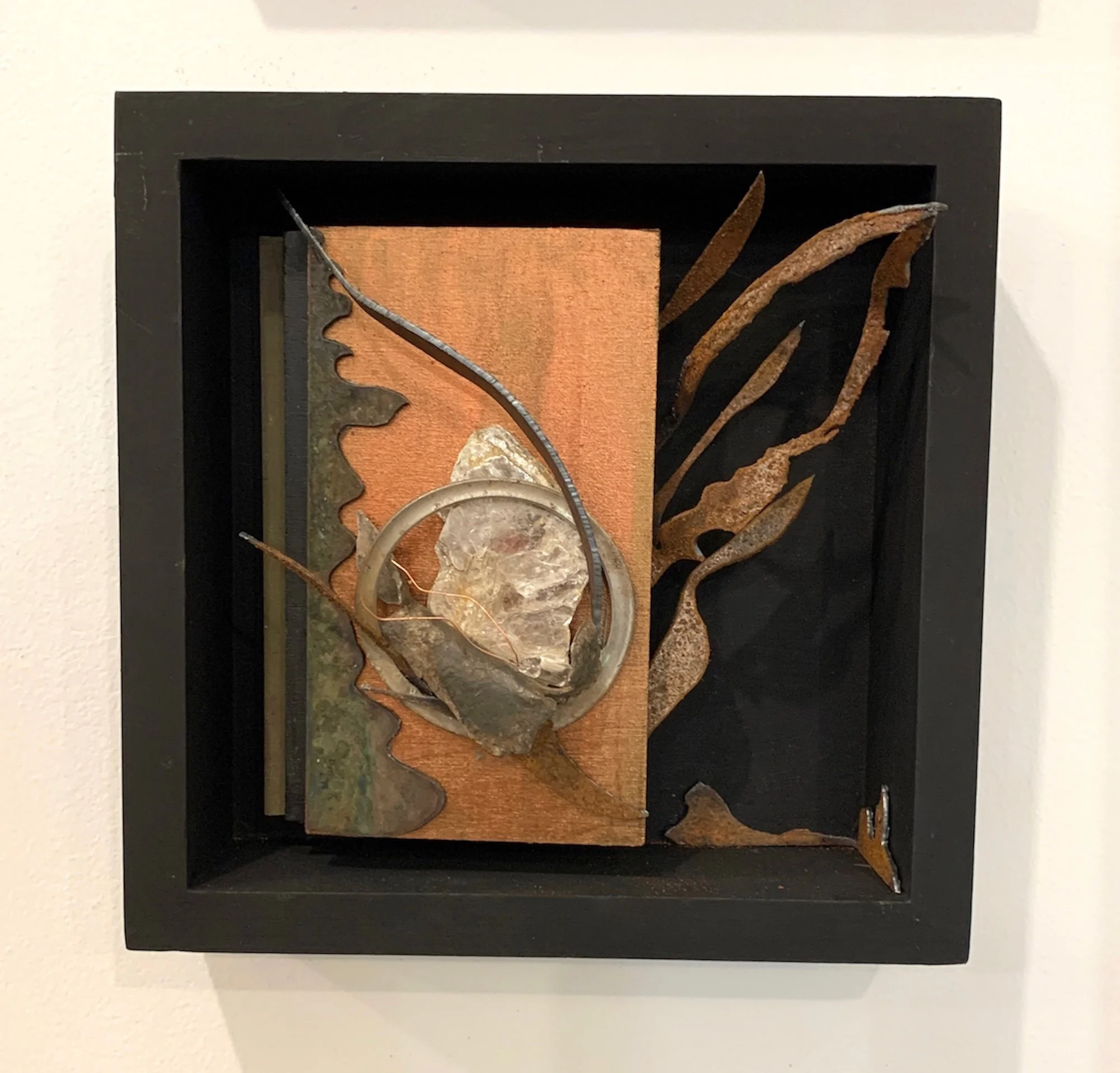 Escape -.A breakaway concept served as the inspiration for this piece. Plasma cut steel, wood, mica, stainless ring.8” x 8” x 1.5”.  2020 (in a private collection)