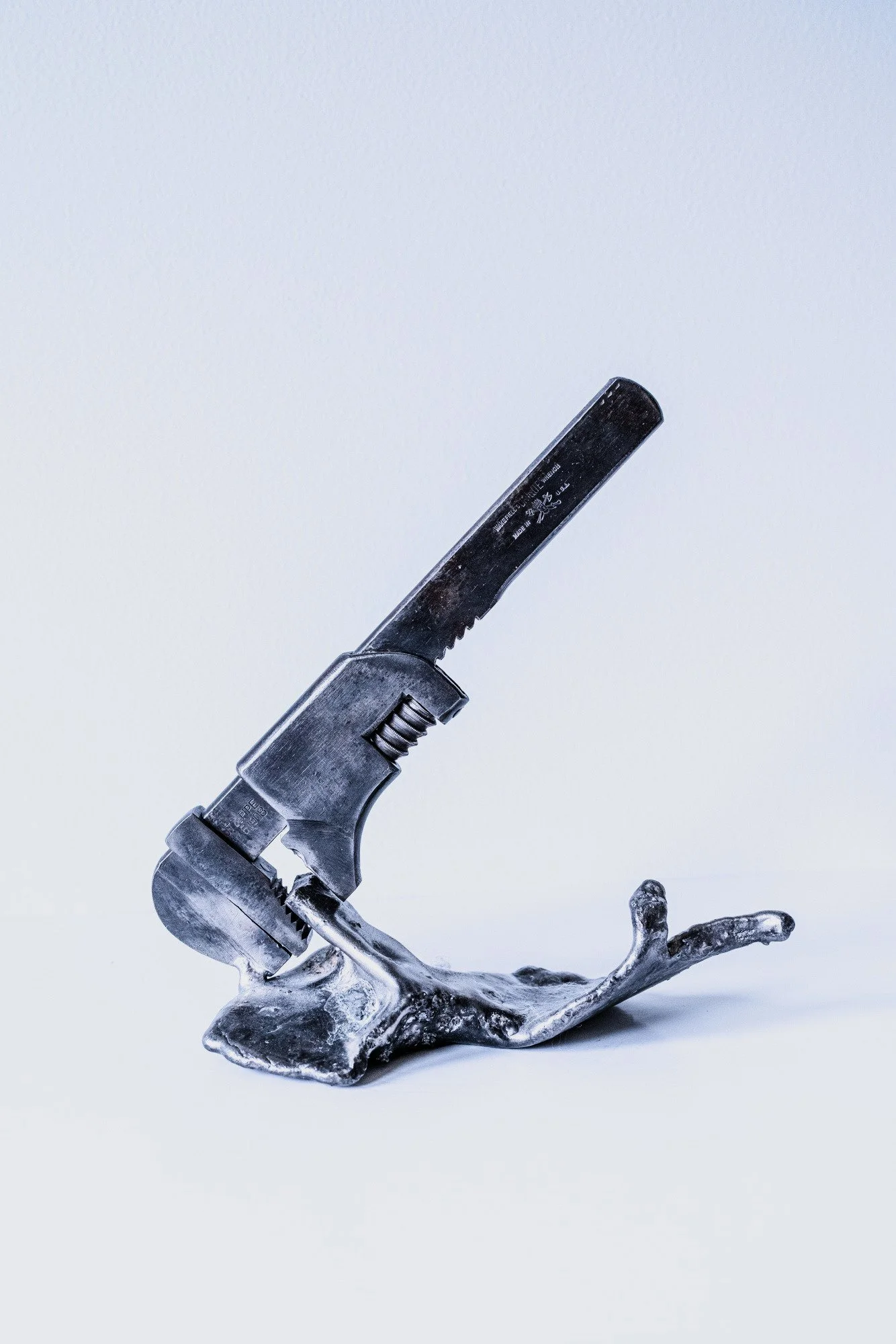 Hold It - Inspired by the instructions and dialog that takes place when working together with another person. Cast stainless steel, vintage nipper tool, welded steel. 9.5” x 9.5” x 4.25”  2019