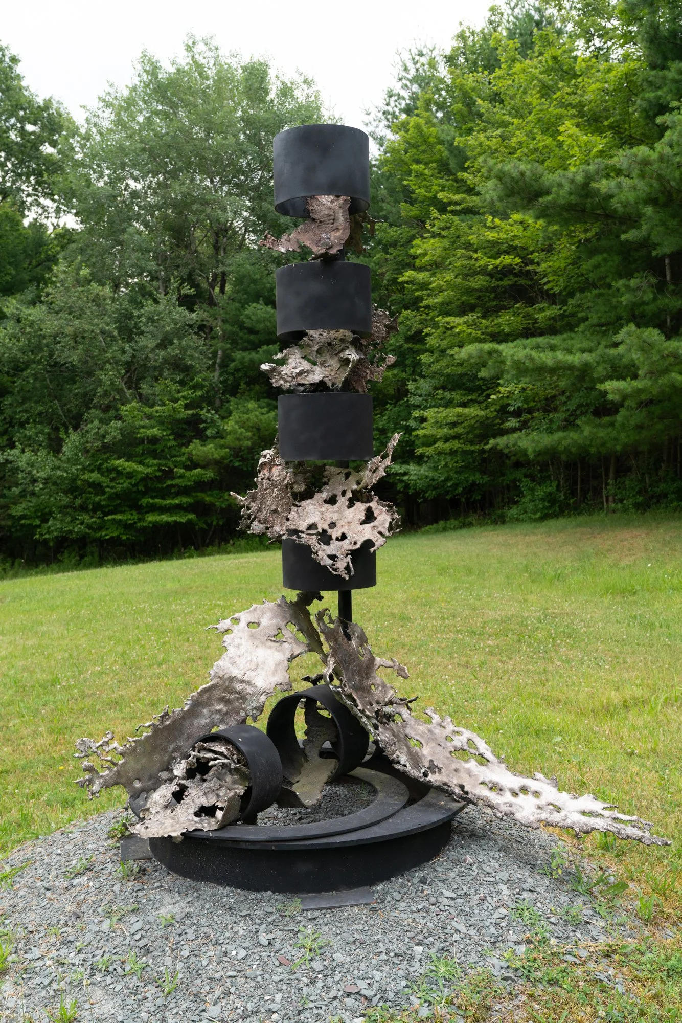Artesian Muse - The inspiration for the work comes from a deep appreciation for water, particularly the form and motion of waterfalls.  Welded steel, cast stainless steel. 88” x 77” x 66”. 1995