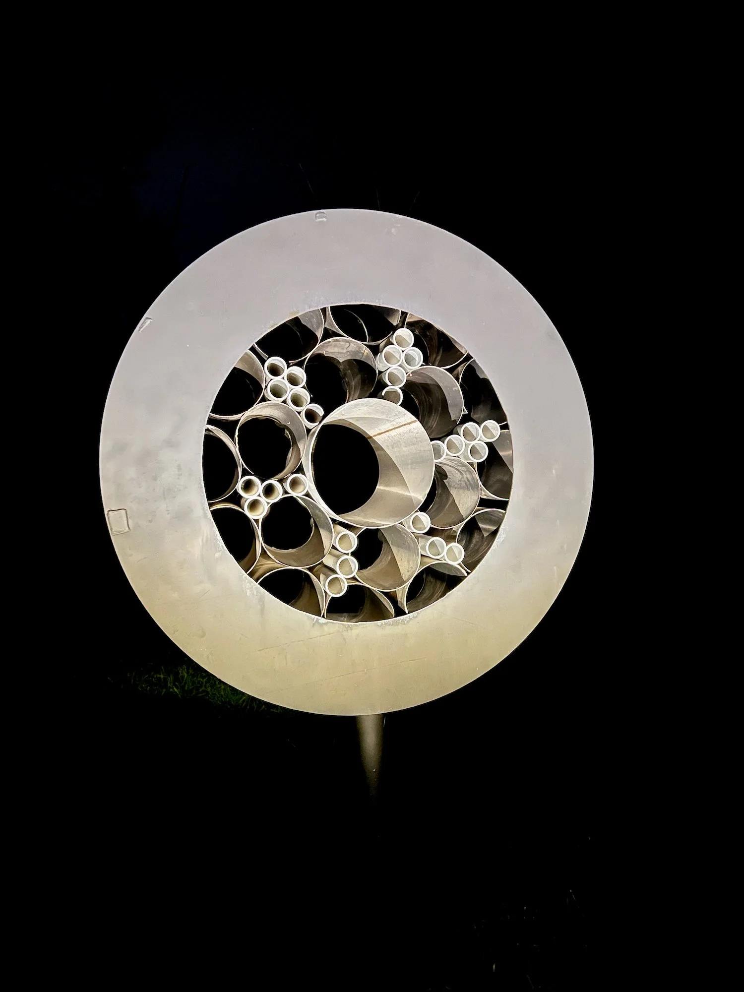 Surveillance - Inspired by the prevalence of monitoring methods that are part of our daily lives. As one drives by this piece, it appears to flicker like it’s taking a photo. Welded steel, stainless steel and aluminum cylinders. 7’5” x 5’ x 30.50”. 2