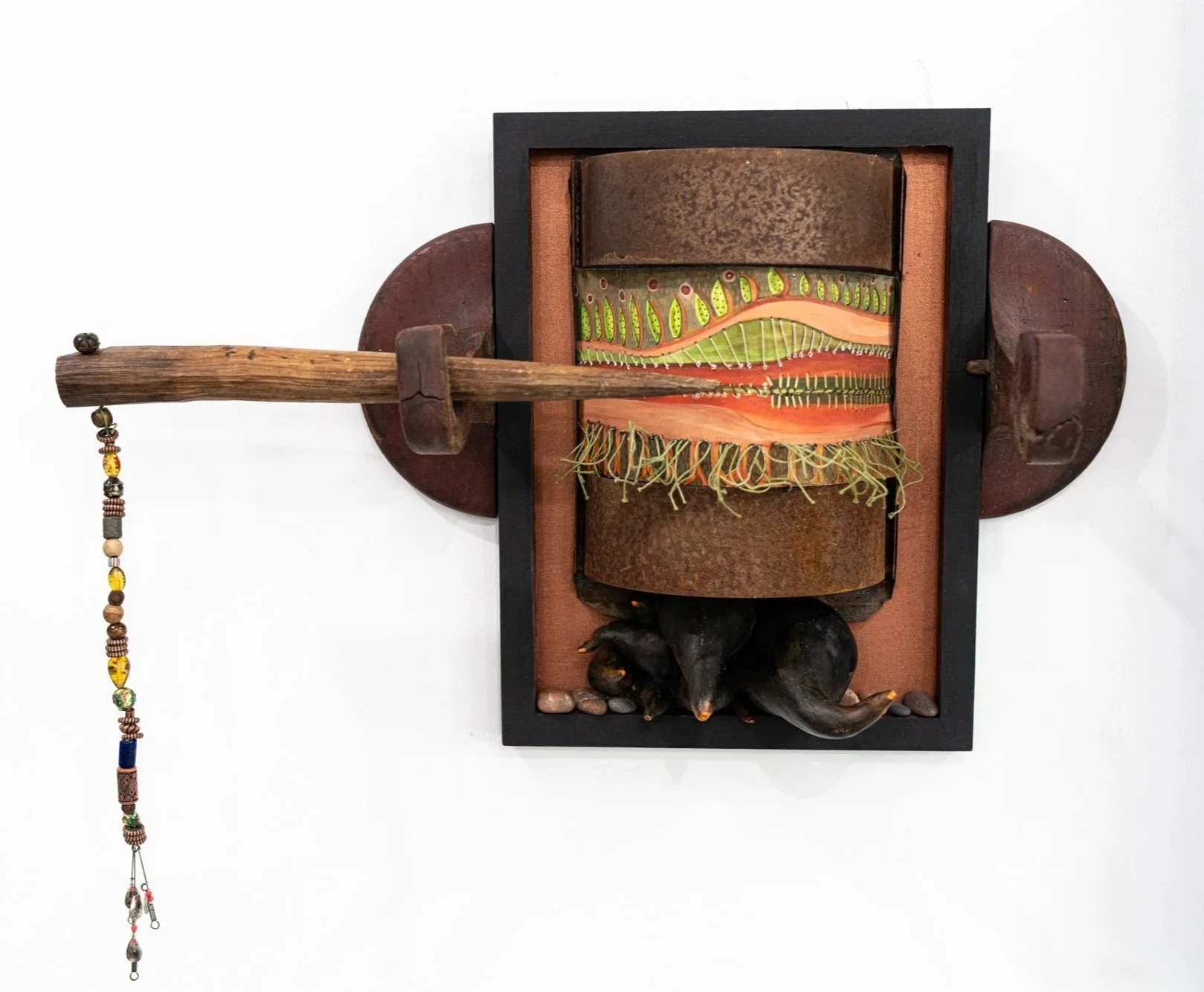 Broken Promises - A failed commitment served as the inspiration for this piece. Wood patterns, steel, clay, rocks, wire, painting, beads, vintage barn beam spike. 16” x 12” x 19”. 2025