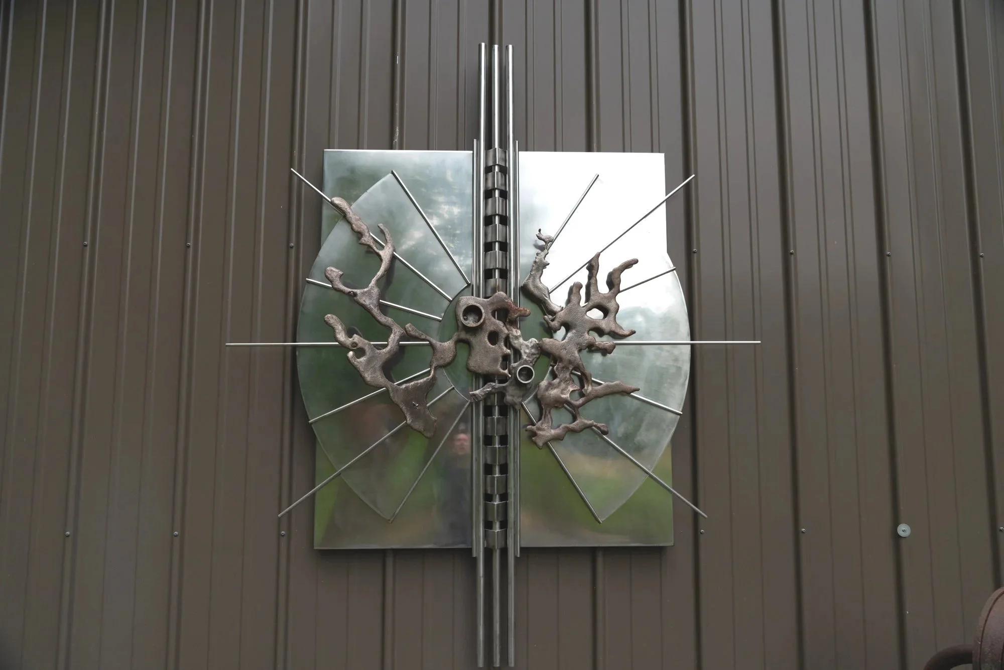 Visionary Burst - Inspired by an intense surge of innovation or creative insight. Welded stainless steel. 6’ x 5’ x 8” 1987