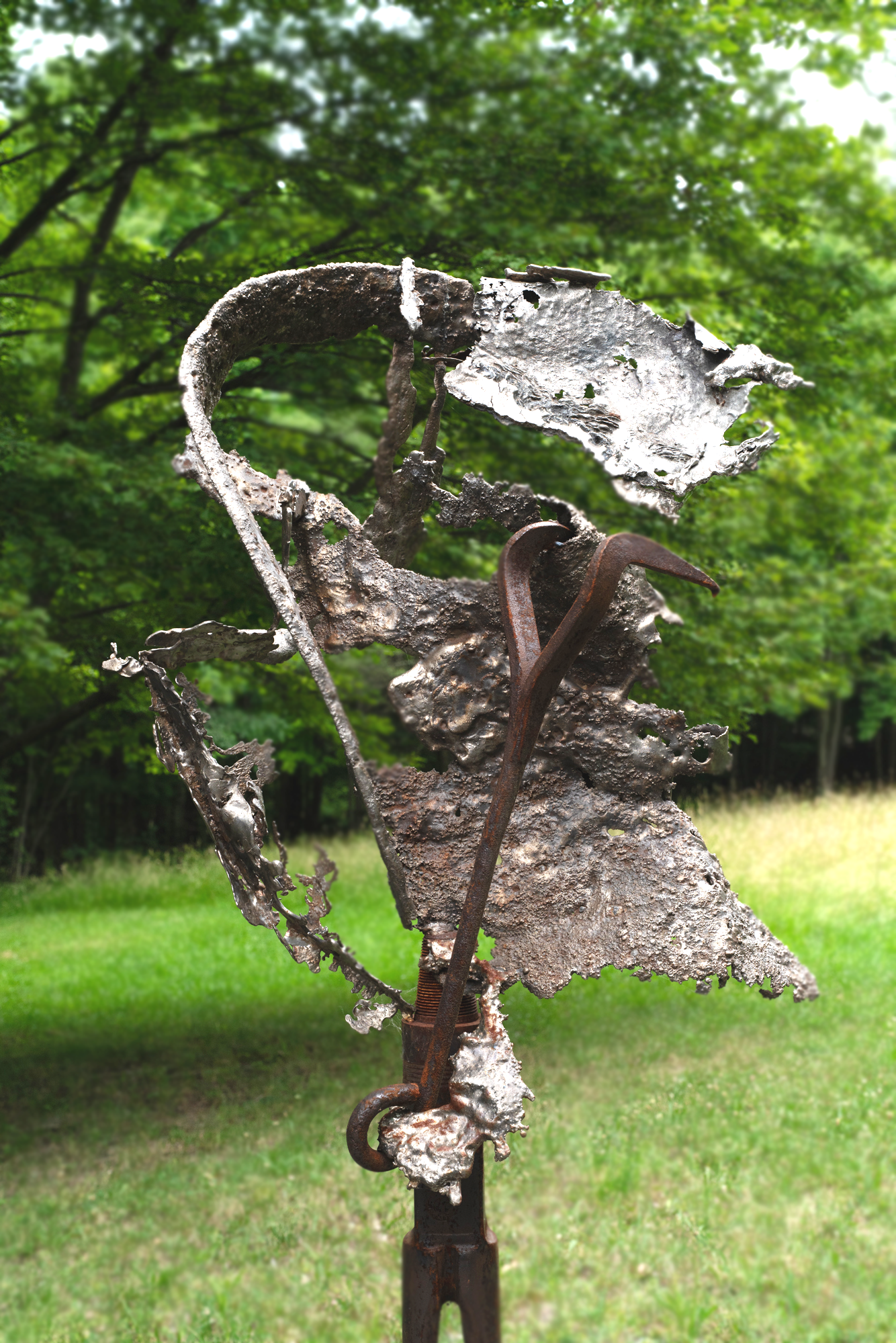 Torrential  - Inspired by the overwhelming intensity of wind and rain. Welded steel, cast stainless, vintage hooks and drill auger. 84” x 34” x 34”. 2022