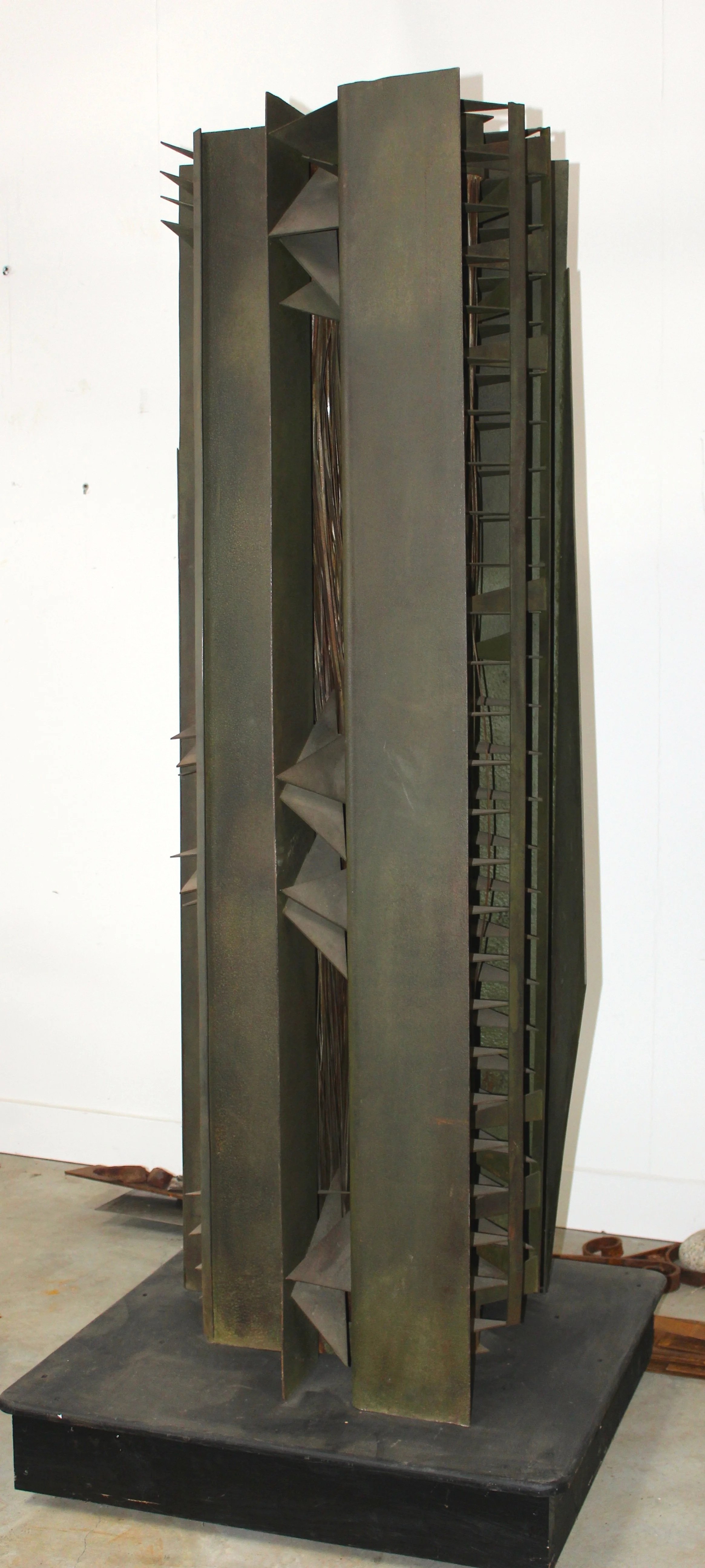 Harvest God - Inspired by the dangers of working with farm machinery. ( A friend lost his hand in a piece of equipment) Welded steel,  78” x 24” x 30”. 1985