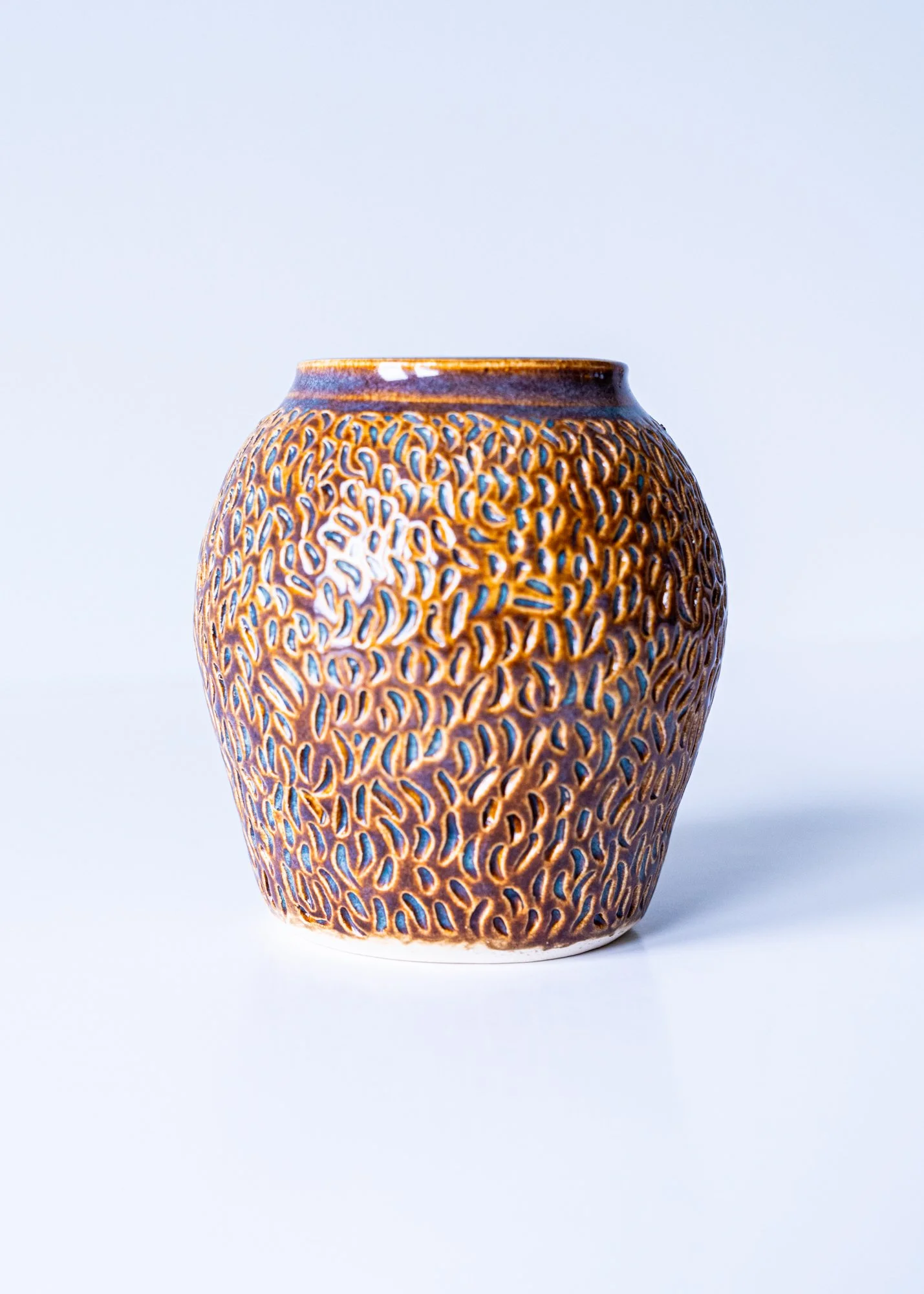Carved Thrown Vessel -  Mid range clay thrown & carved. Glazed rust. 4” x 3.5” x 3.5”