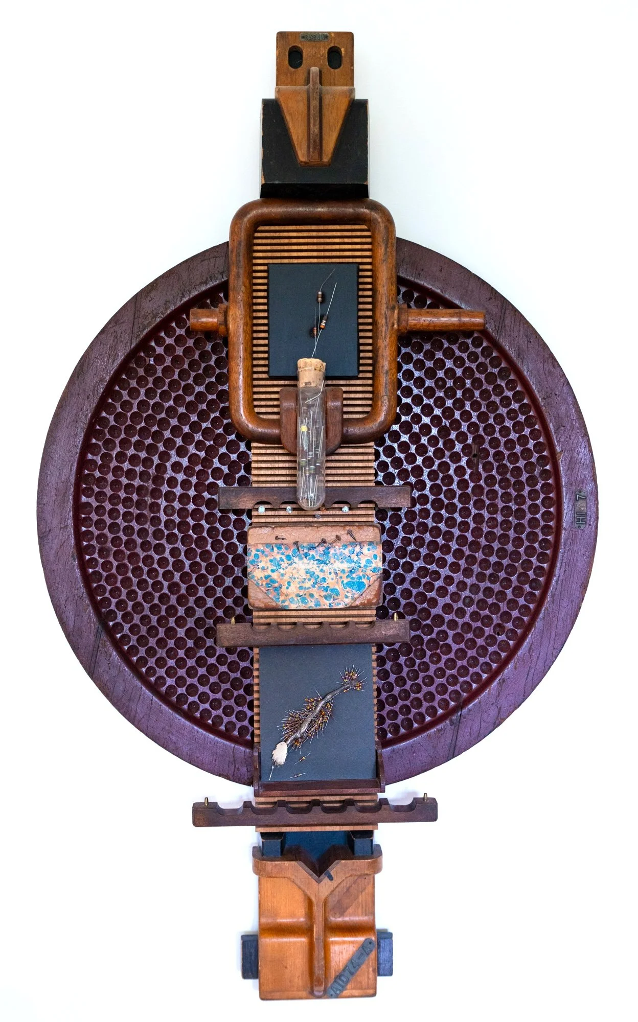 Specimen - Inspired by the test tube holding resistors. Wood pattern pieces, vintage book cover, electrical components, canvass, matt board. 42” x 36” x 4.5”. 2014
