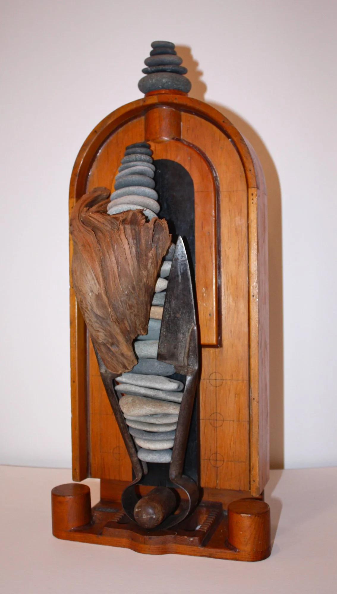 Severed Tide - Concept of cutting off or detaching from a connection. Wood pattern piece, vintage clippers, stones, drift wood. 20” x10” x5” 1992. (in a private collection) 
