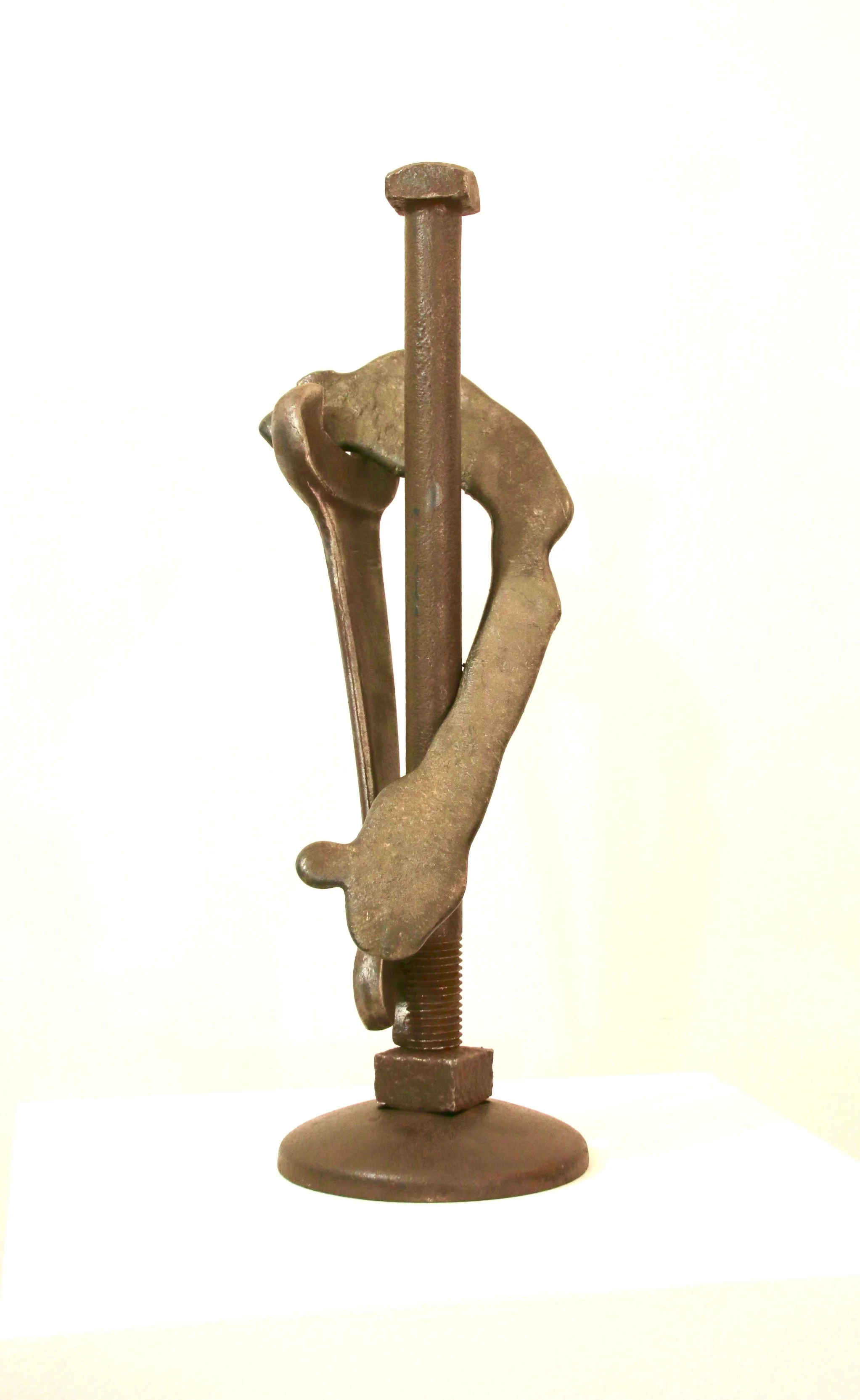Envelop - Inspired by the idea of wrapping and surrounding a physical object or person. Industrial screw and bolt, wrench, cast stainless steel. 19.5” x 6.5” x 6.5”. 2019 (in a private collection) 
