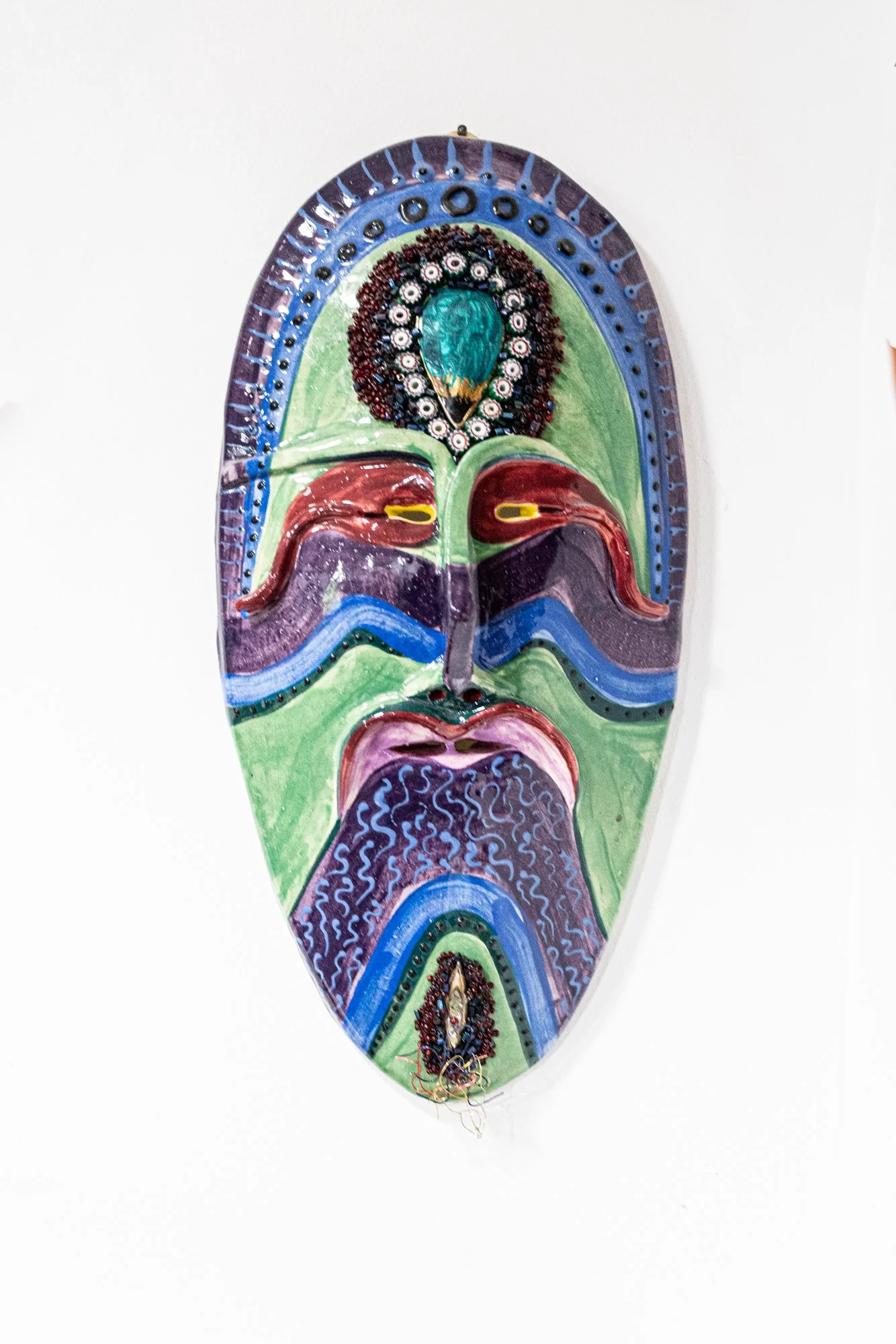 Earth Spirit Mask - Intuitively modeled. Low fire clay, underglaze decorations, beads. 16” x 6” x 2”
