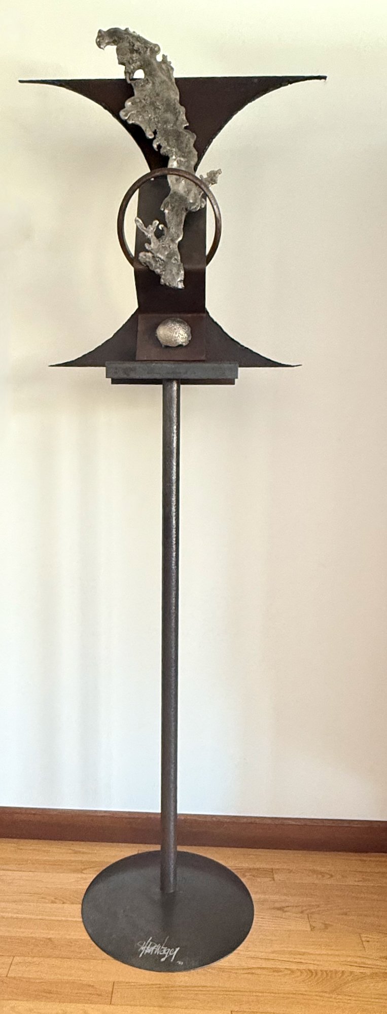 Interject - Concept of an abrupt  interruption. Welded steel, cast stainless steel. 82” x 27” x 17”. 1990 