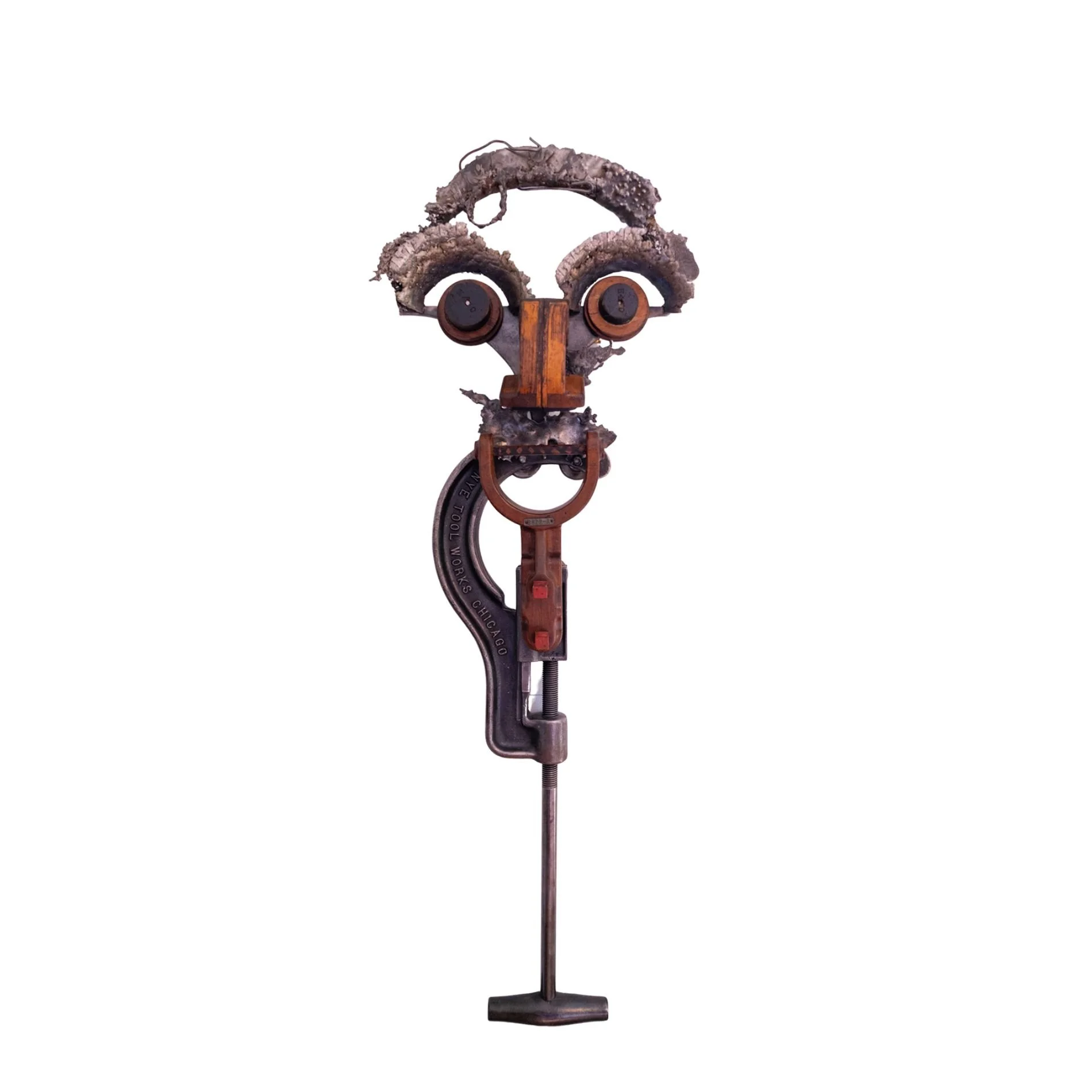 Elmer - Inspired by the image of Professor Lawson. Vintage pipe cutter, wood pattern pieces, cast stainless steel. 47” x 17” x17”. 1999