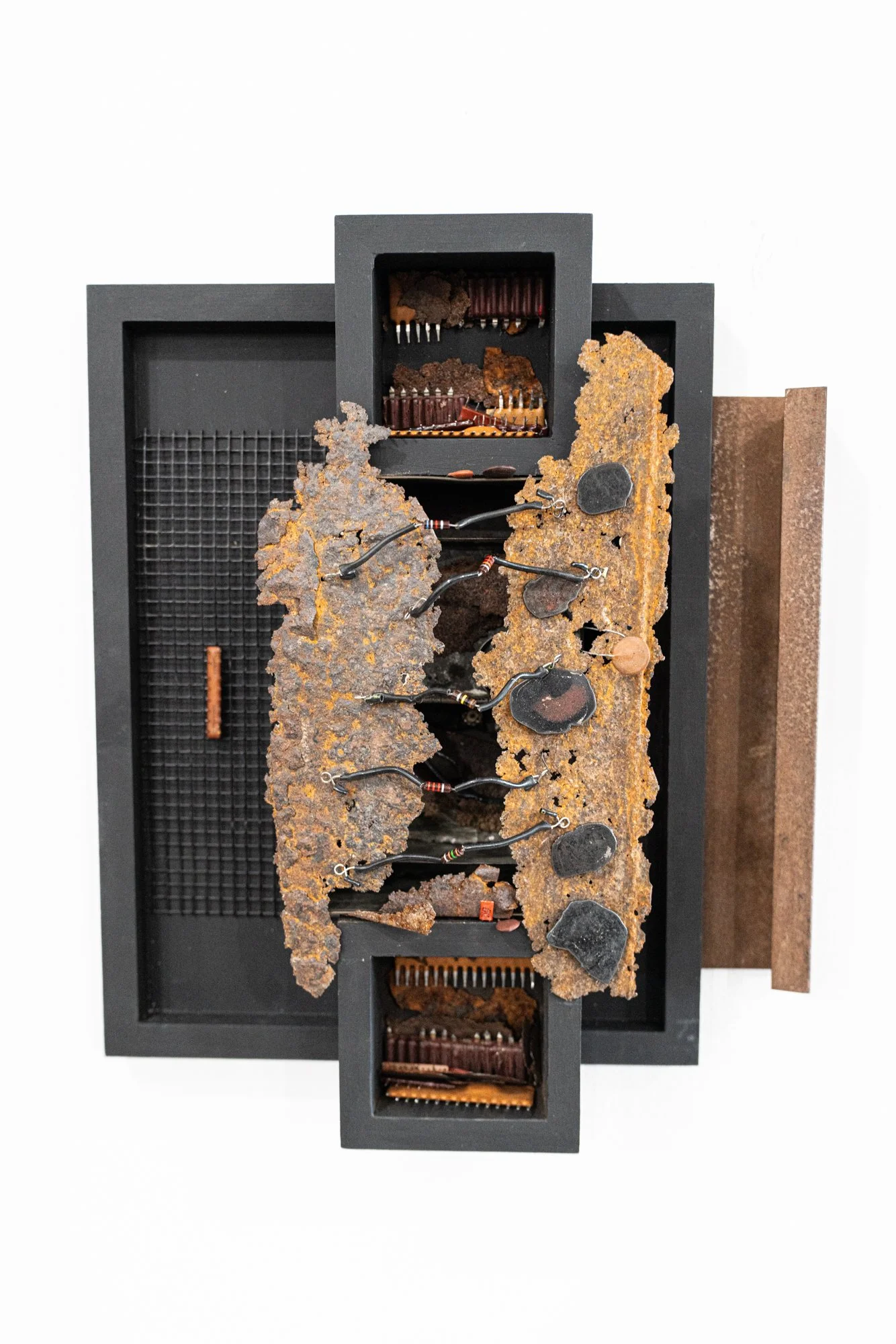 Extraction - The inspiration comes from the idea of subtraction or removing from a larger area. Wood, screen, rusty steel, electrical components. 13.5” x 13” x 9” 4.25”. 2025