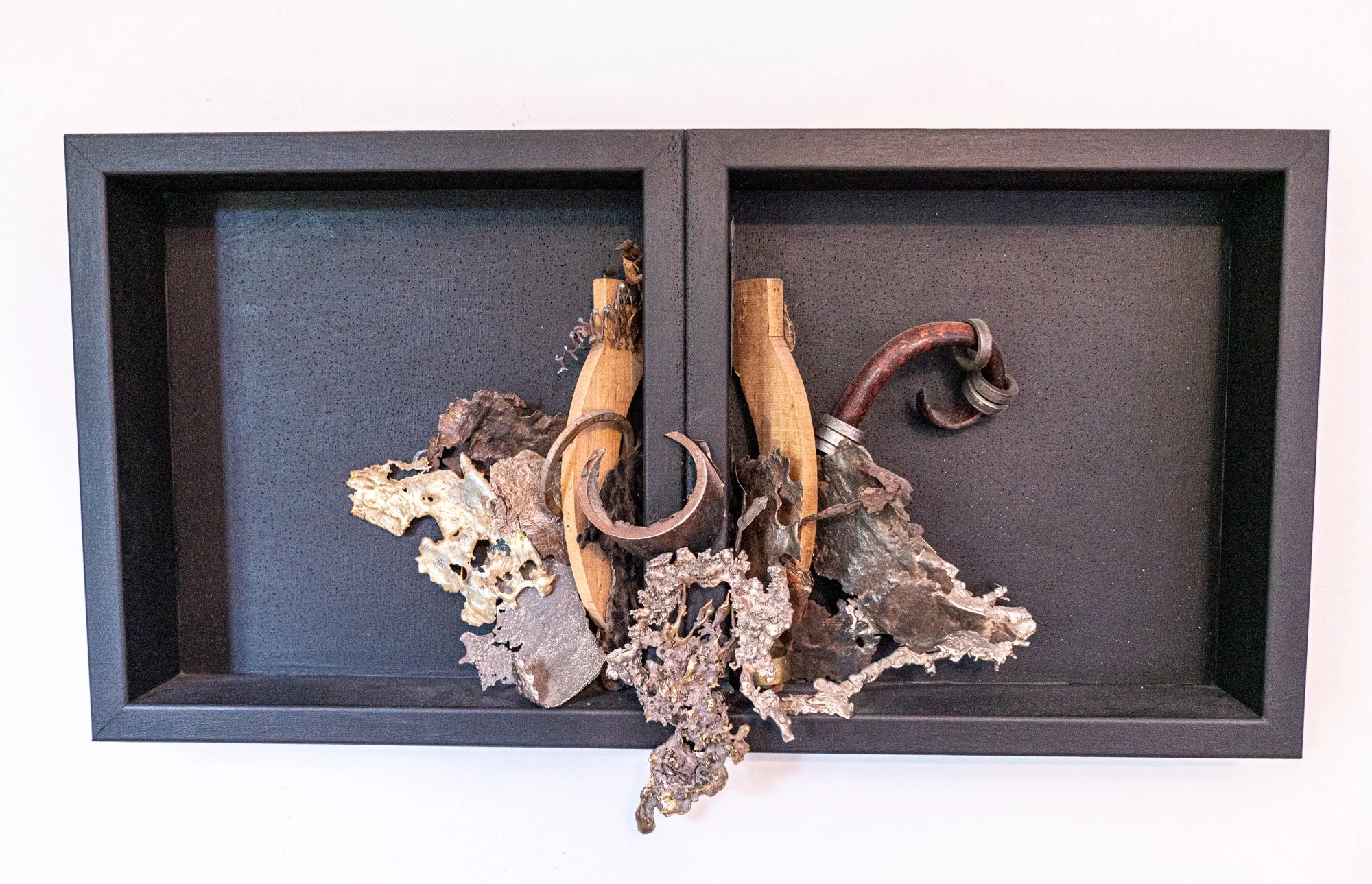Fall Out - Driven by the lasting impact, outcome, or resulting set of consequences. Wood, bronze, cast stainless steel, mild steel. 12” x 24” x 4” 2018