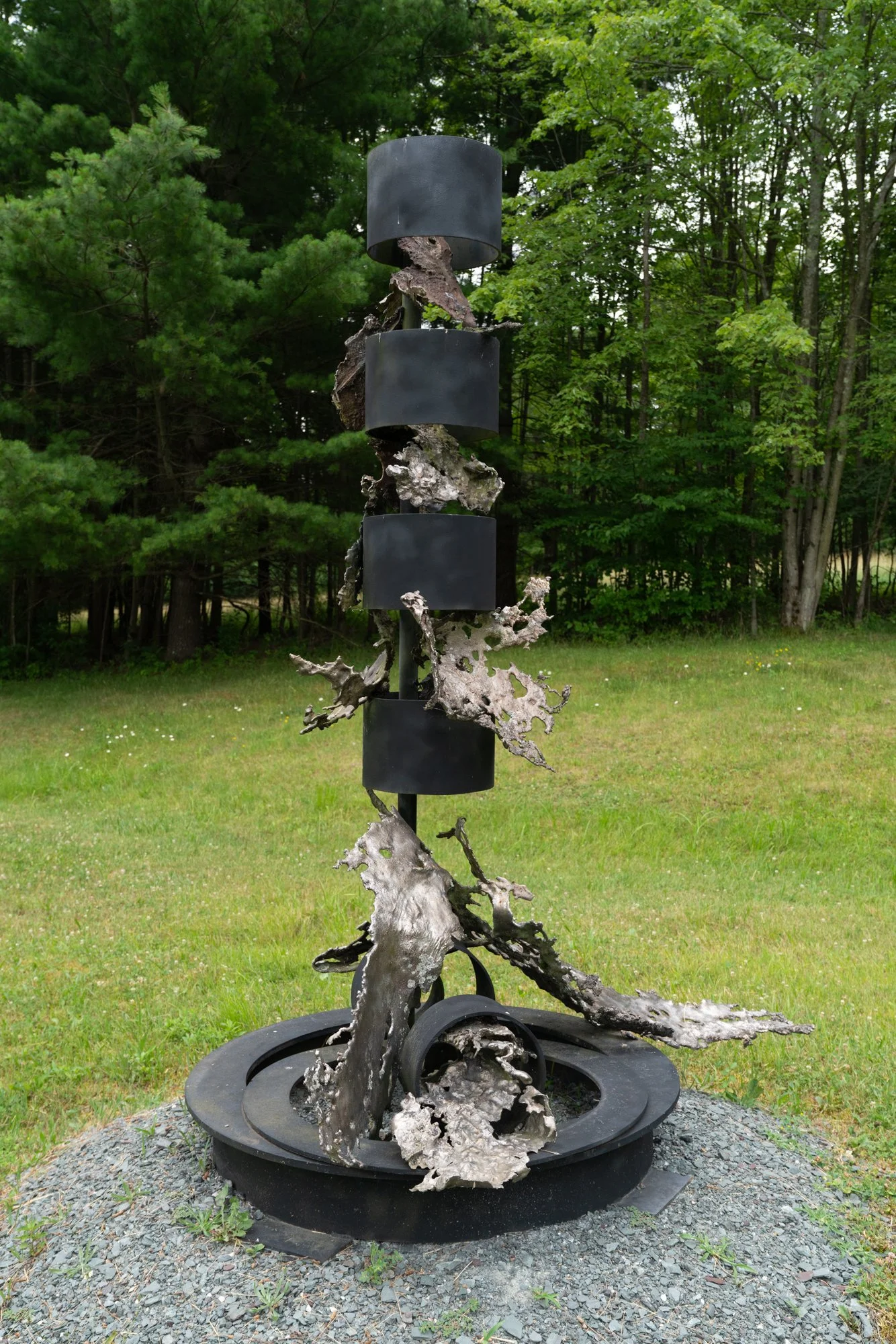 Artesian Muse - The inspiration for the work comes from a deep appreciation for water, particularly the form and motion of waterfalls.  Welded steel, cast stainless steel. 88” x 77” x 66”. 1995