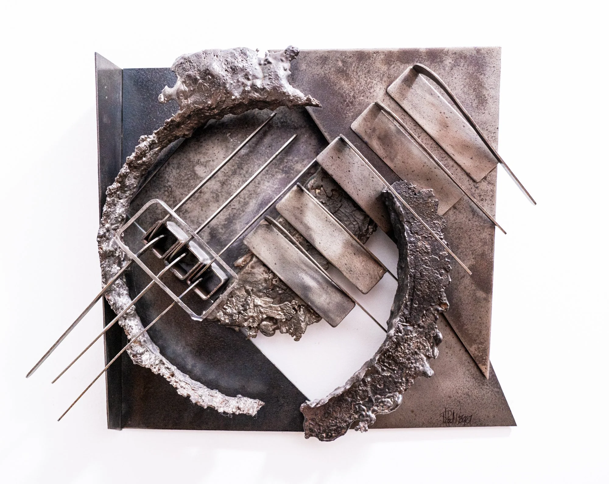 Extruding Sequence -  This work is inspired by using formal elements in its composition to create diagonal  contrasts. Cast stainless and welded steel. 13.5” x 18’ x 4.5”. 1989 