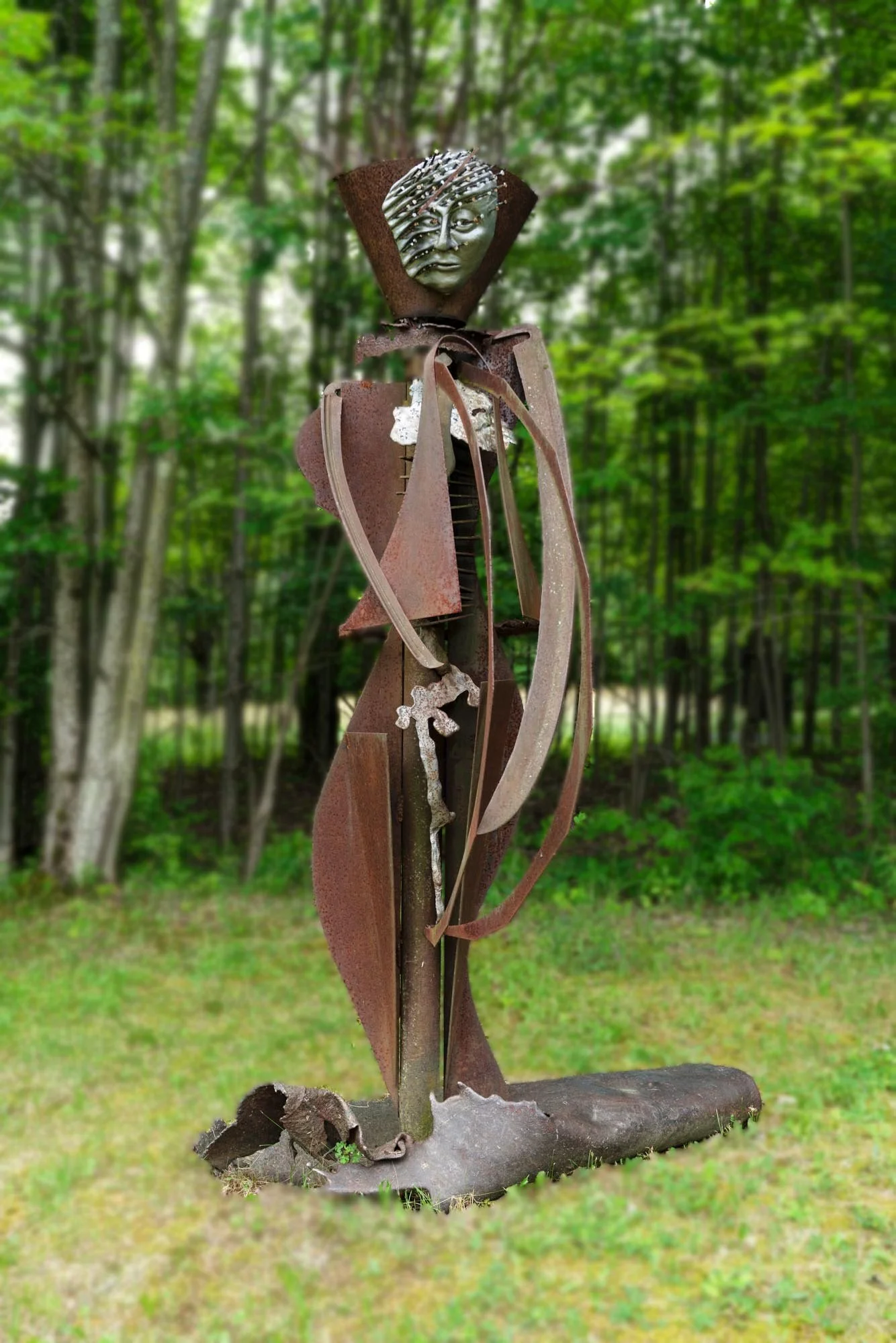 Agrarian - Inspired by the agrarian way of life in the rural upstate NY. Much of the steel in my collection has come from abandoned & outdated  farm equipment. Welded salvaged steel, modeled clay face with horse shoe nails. 8’5” x 3’ x 3’. approx. 19