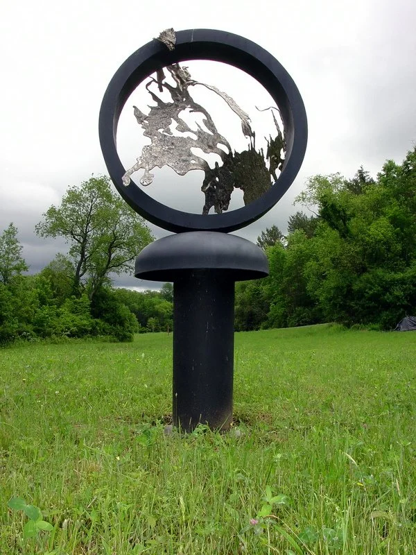 Central Essence - Inspired by the striking, beautiful form at its center, which is crafted from cast stainless steel. Welded steel, cast stainless steel, deconstructed tanks.  7'6" x 4' x 4'.  2009
