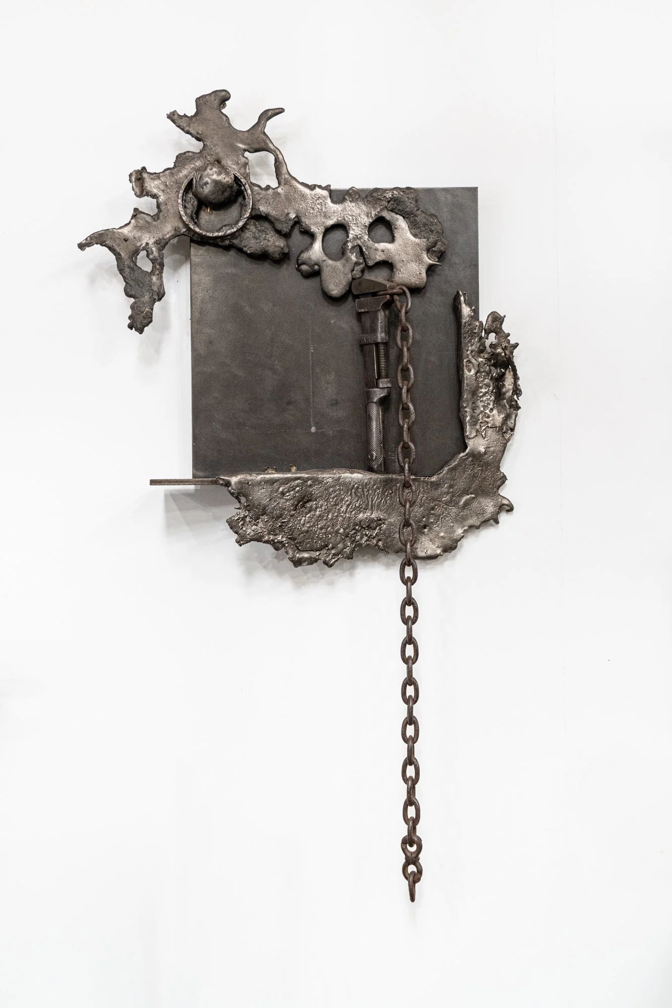 Evidence - Inspired by the idea of finding clues with what is left remaining.
Vintage chain & wrench, cast stainless steel. 49’ x 30” x5”. 1993