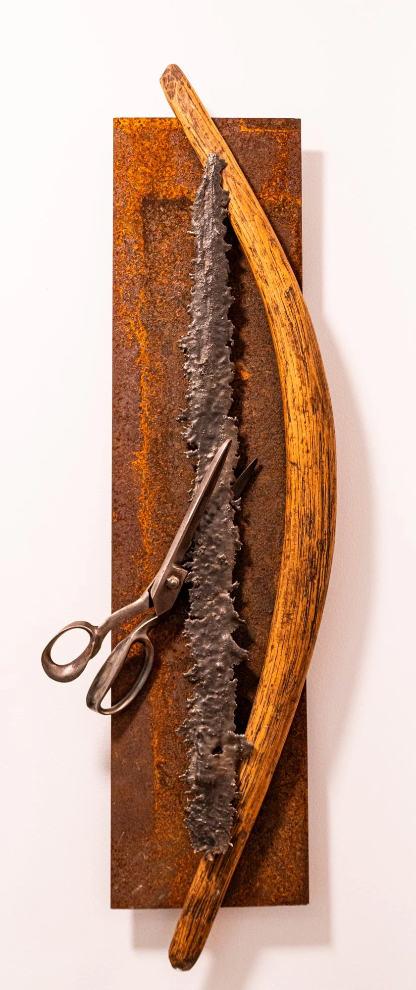 Sever -  Inspired by the large industrial scissors seen in this piece. Welded steel, wood,cast stainless steel, vintage, industrial scissors. 37” x 13’ x 3” 2008