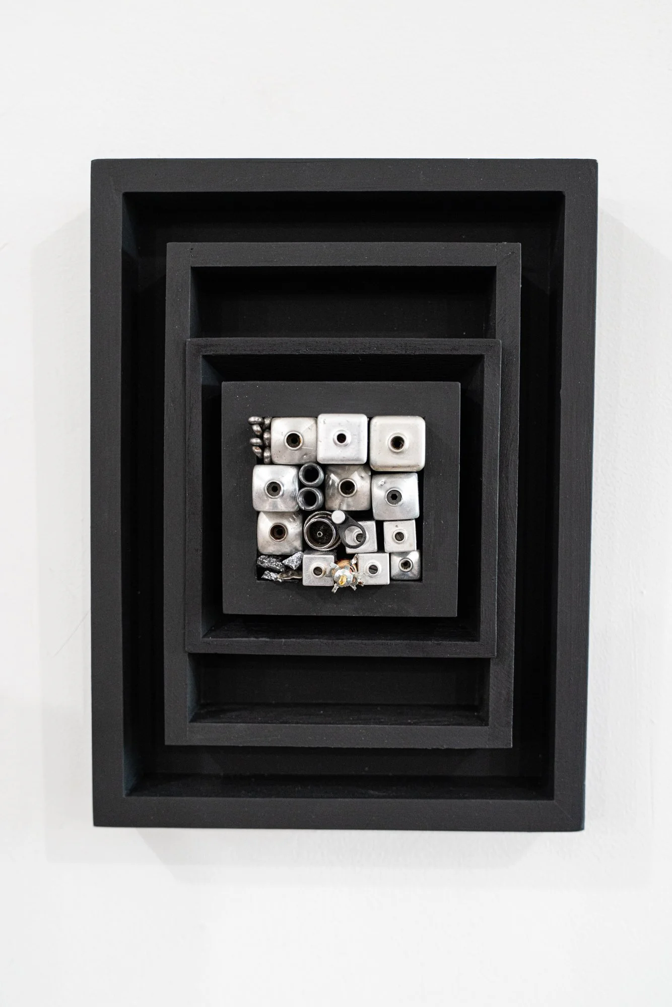 Detention - Ones’ experience of punitive incarceration. Wood, electronic components, aluminum, silica ore. 12” x 9” x 3.5” 2025 ( in a private collection)