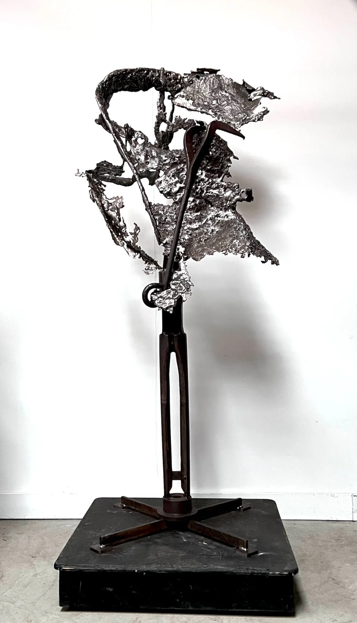Torrential - Inspired by the intense, violently severe effects of wind. Vintage well drilling bit, cast stainless steel, vintage tools. 84” x 34” x 34” . 2022