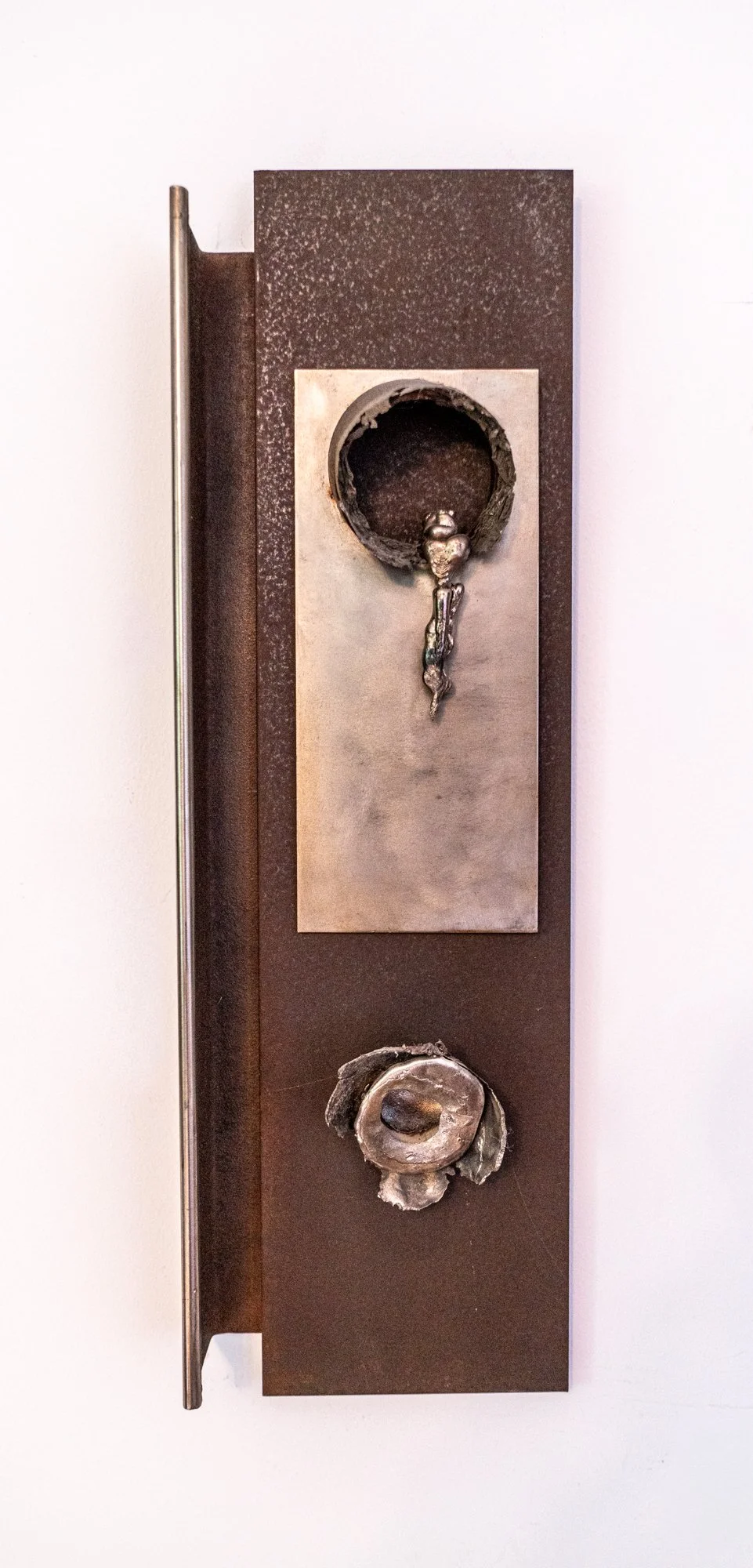 Empty - Inspired by the idea of discharge or loss. Cast stainless steel, mild steel. 26” x 8” x 3”. 2006
