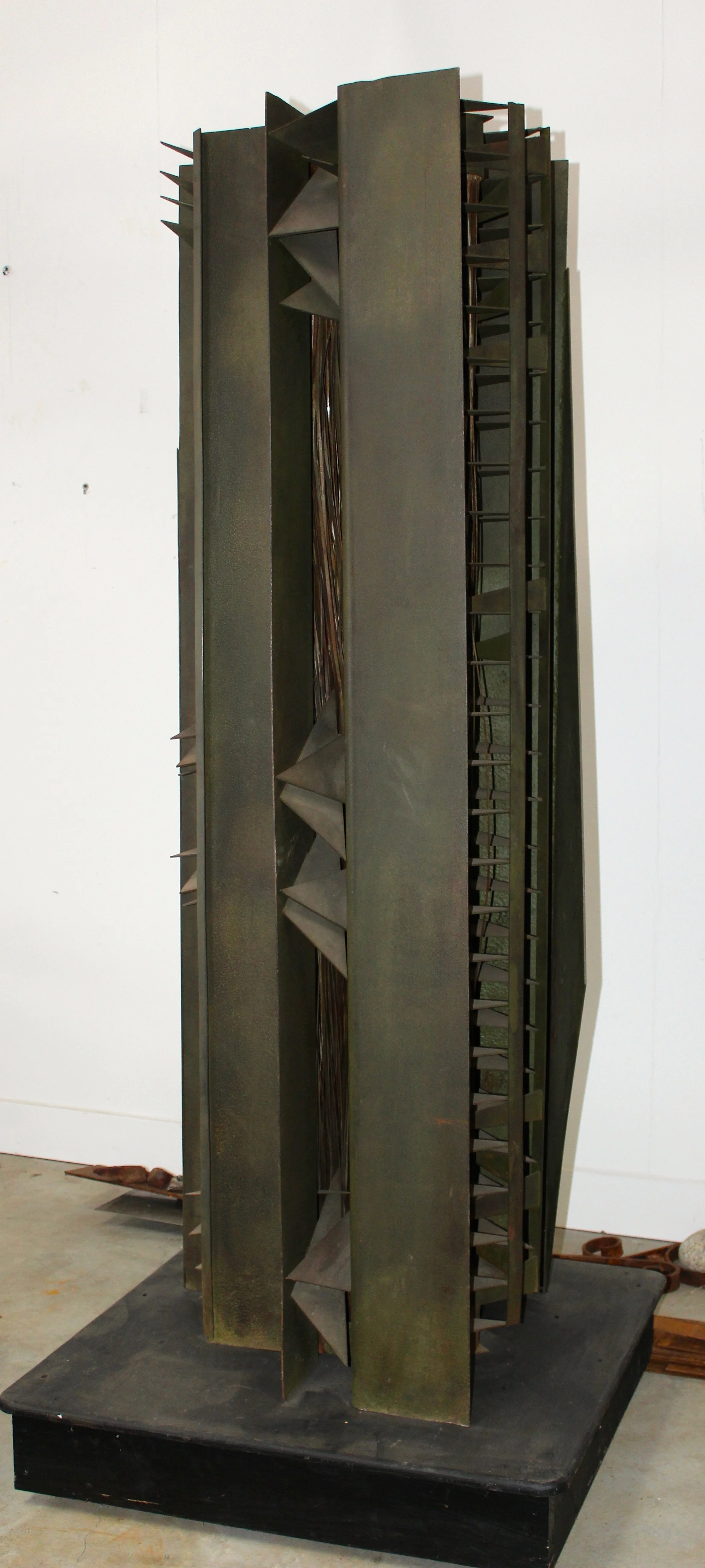 Harvest God - Inspired by the dangers of working with farm machinery. ( A friend lost his hand in a piece of equipment) Welded steel,  78” x 24” x 30”. 1985