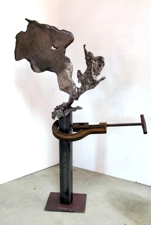 Torqued - Inspired by the large pipe cutter acquired from a well drilling business. Cast stainless steel, welded steel, vintage pipe cutter tool. 5’4” x 2’8” x 14”. 2000