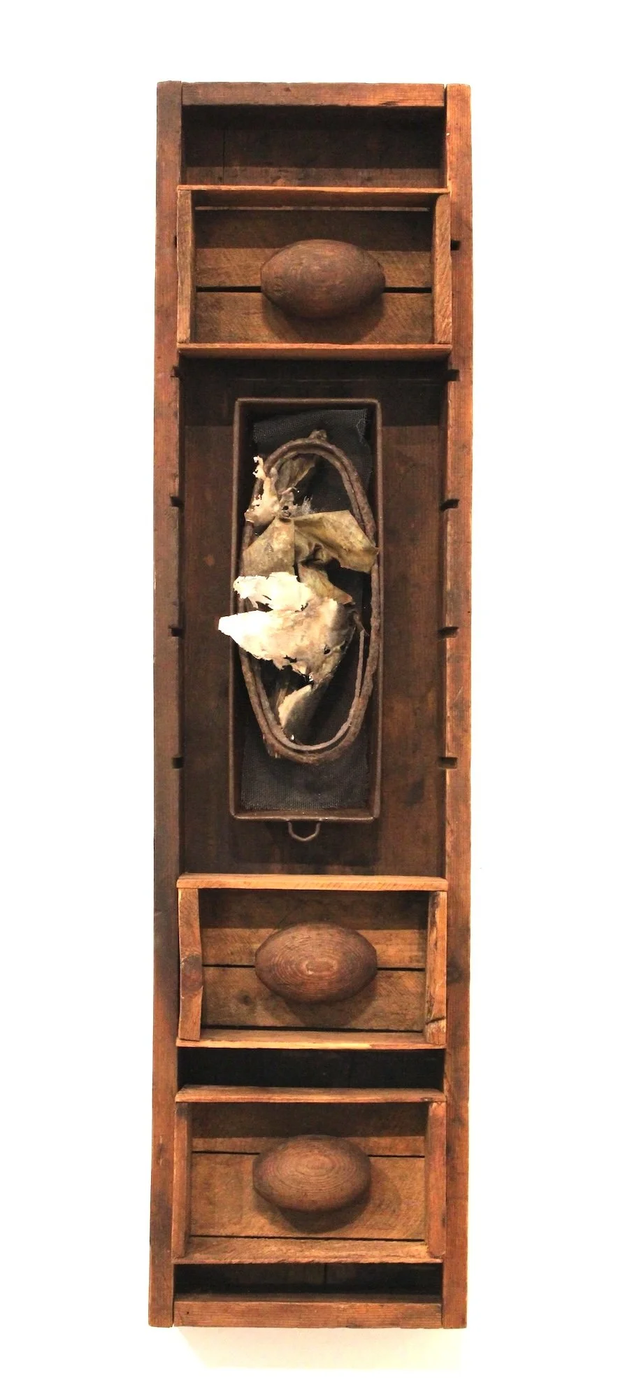 Baked - Inspired by the vintage bread pan found in the center of this piece. Wood, boxes and oval forms, cast stainless steel. 38.5” x  9 ¾” x 5”. 2013.