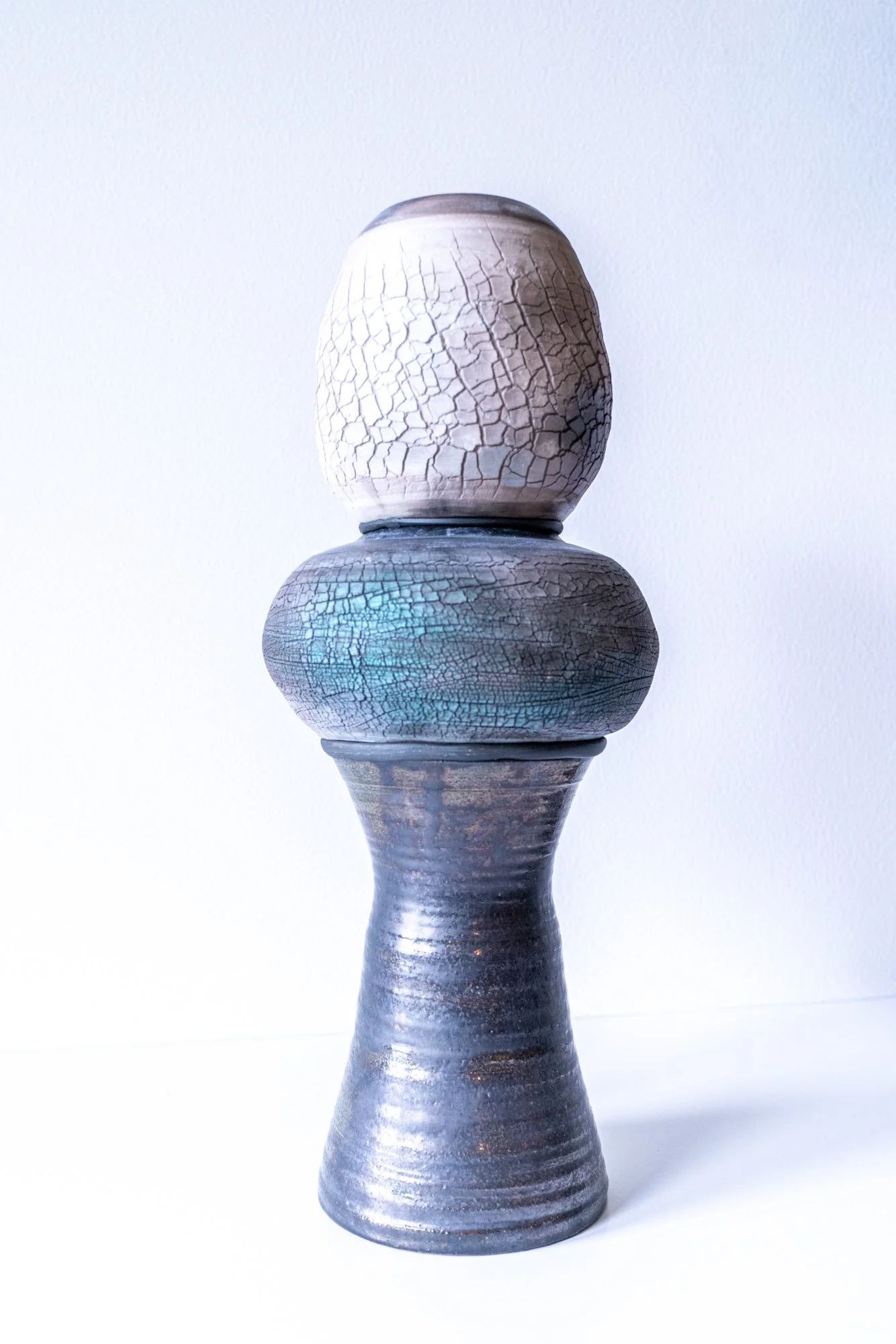 CT/V4 - Shapely Totem - Intuitively assembled. Three thrown clay forms- two crackle techniques. 16.25’ x 6.75” x 6.75”. 2023