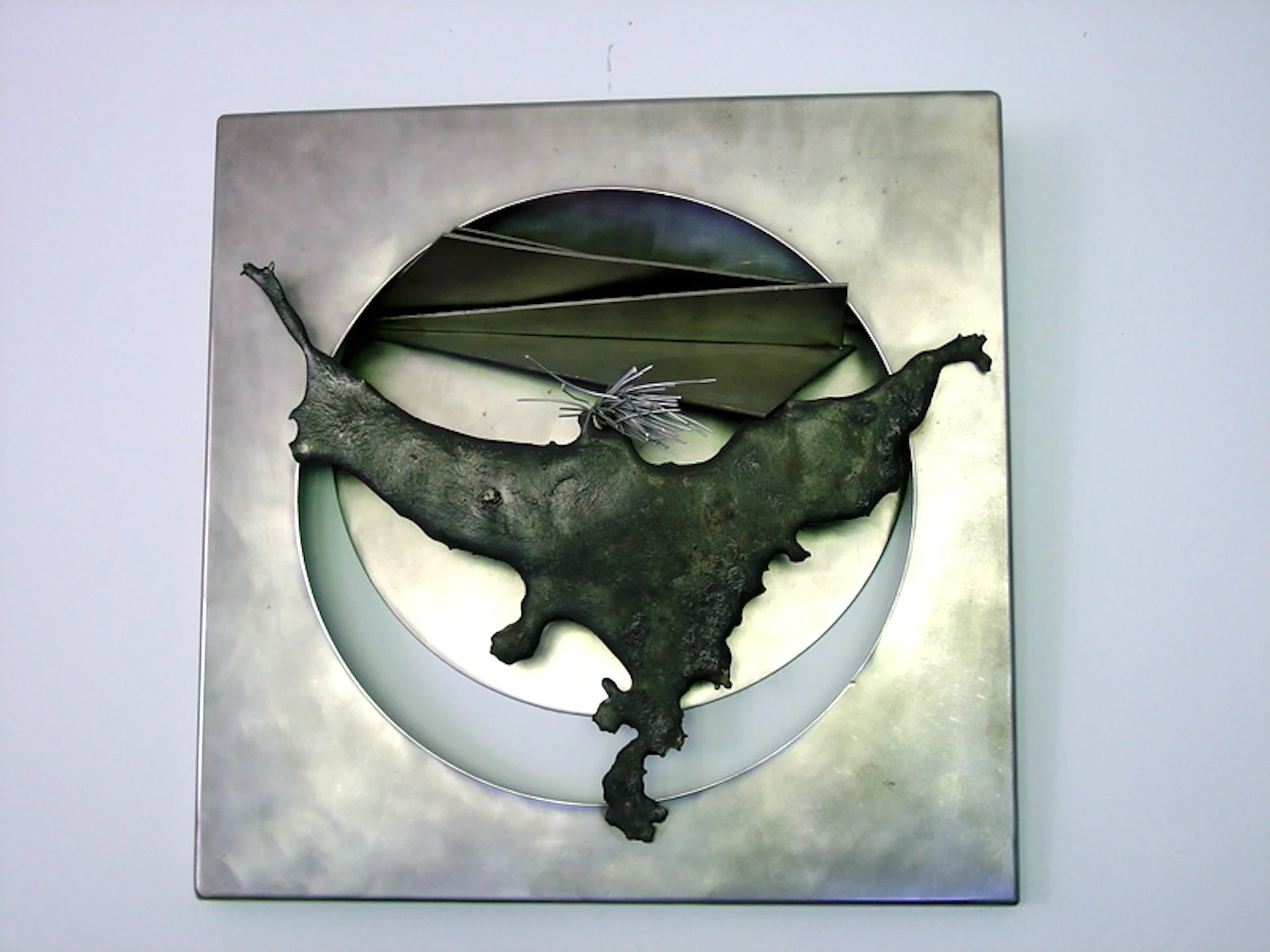 Screaming Trails - Inspired by the lasting effects of a revelation. Welded stainless steel, aluminum wire. 21” x 21” x 5”. 1989 (in a private collection)