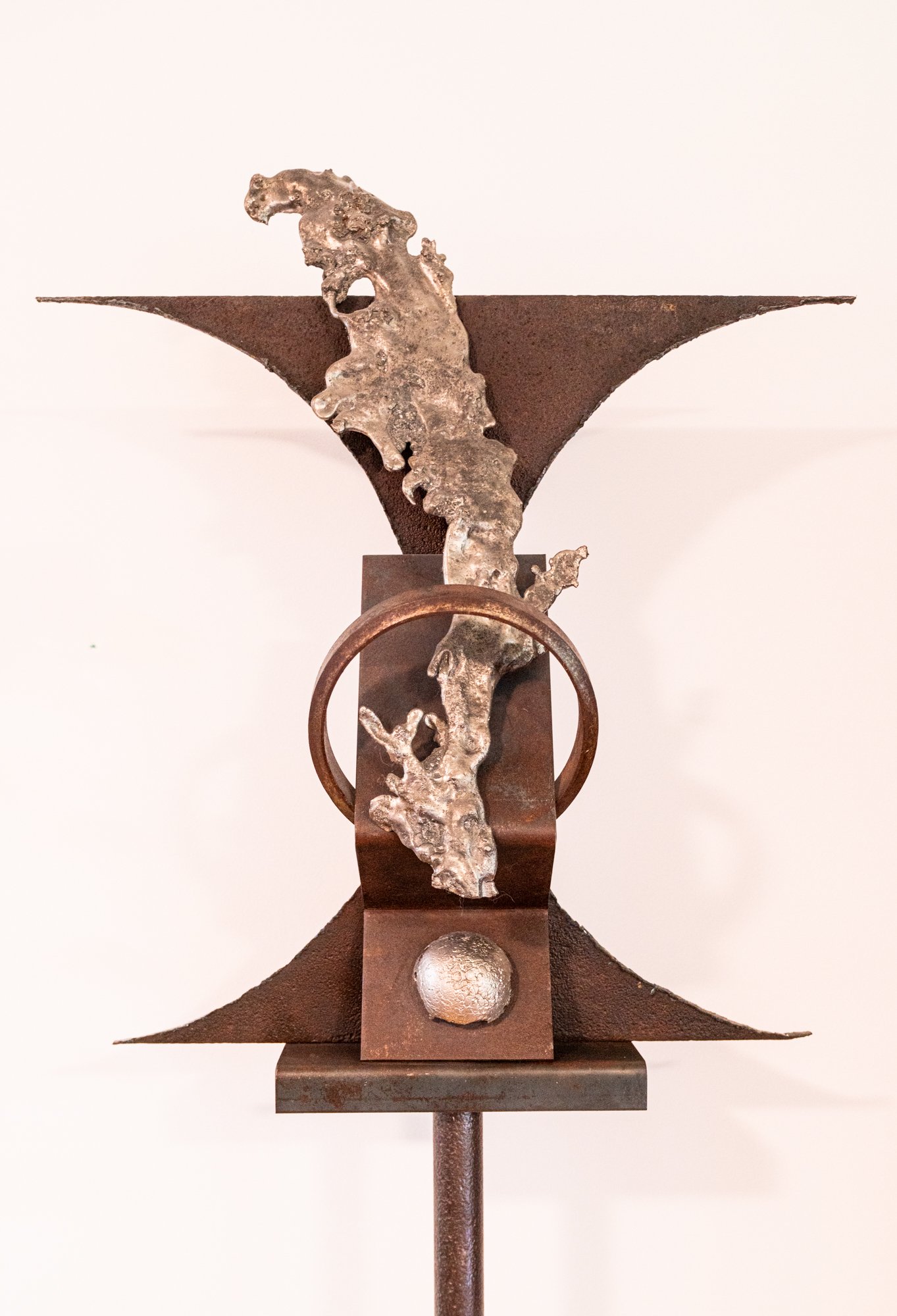 Interject - Concept of an abrupt  interruption. Welded steel, cast stainless steel. 82” x 27” x 17”. 1990 
