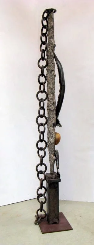 Stone Sentry - Created to indicate guarding an entrance. Cast stainless steel, vintage chain, stone. 78” x 14” x 11”. 2007 