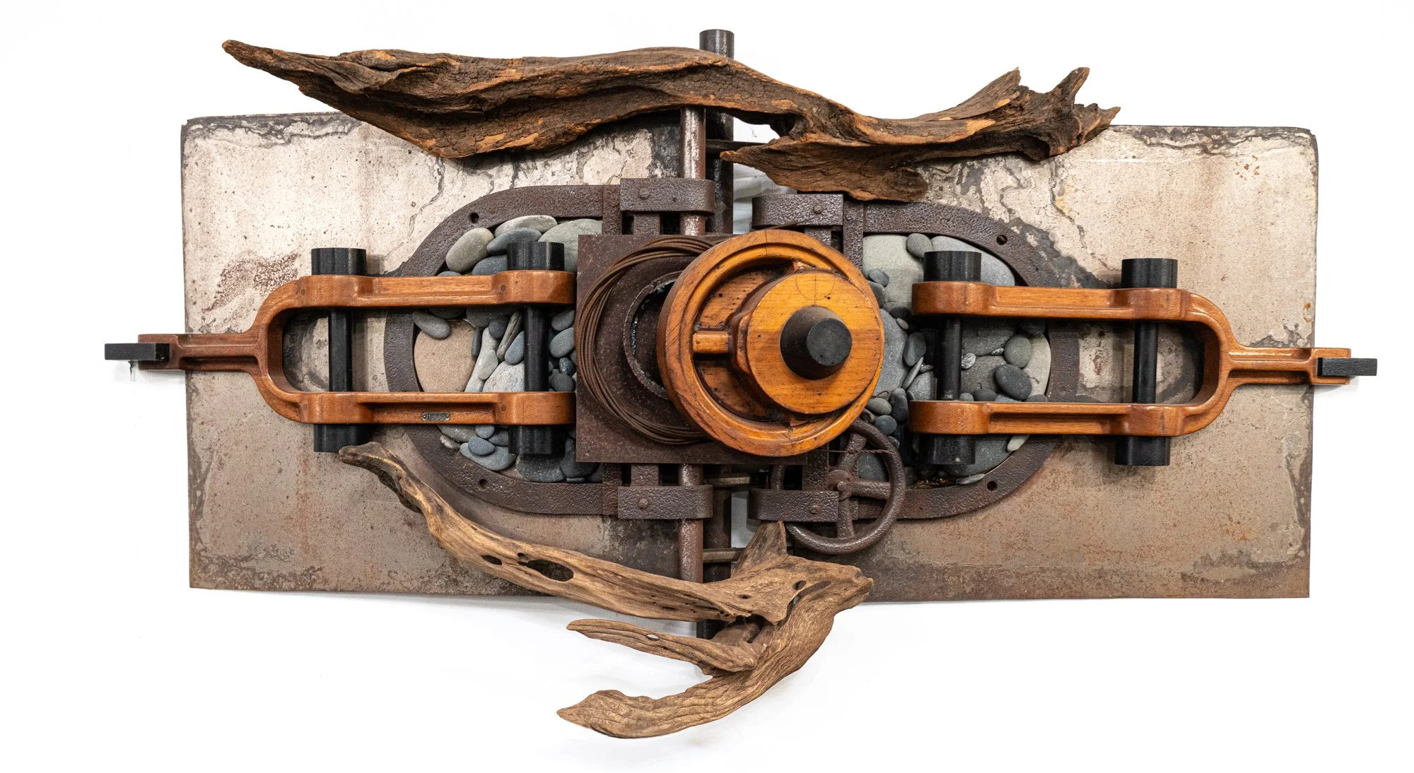 Unhinged - Inspired by the idea of being attached but disconnected. Drift wood, wood patterns, barn door hinges, stones, steel. 30’ x 48’ x 15”. 1999