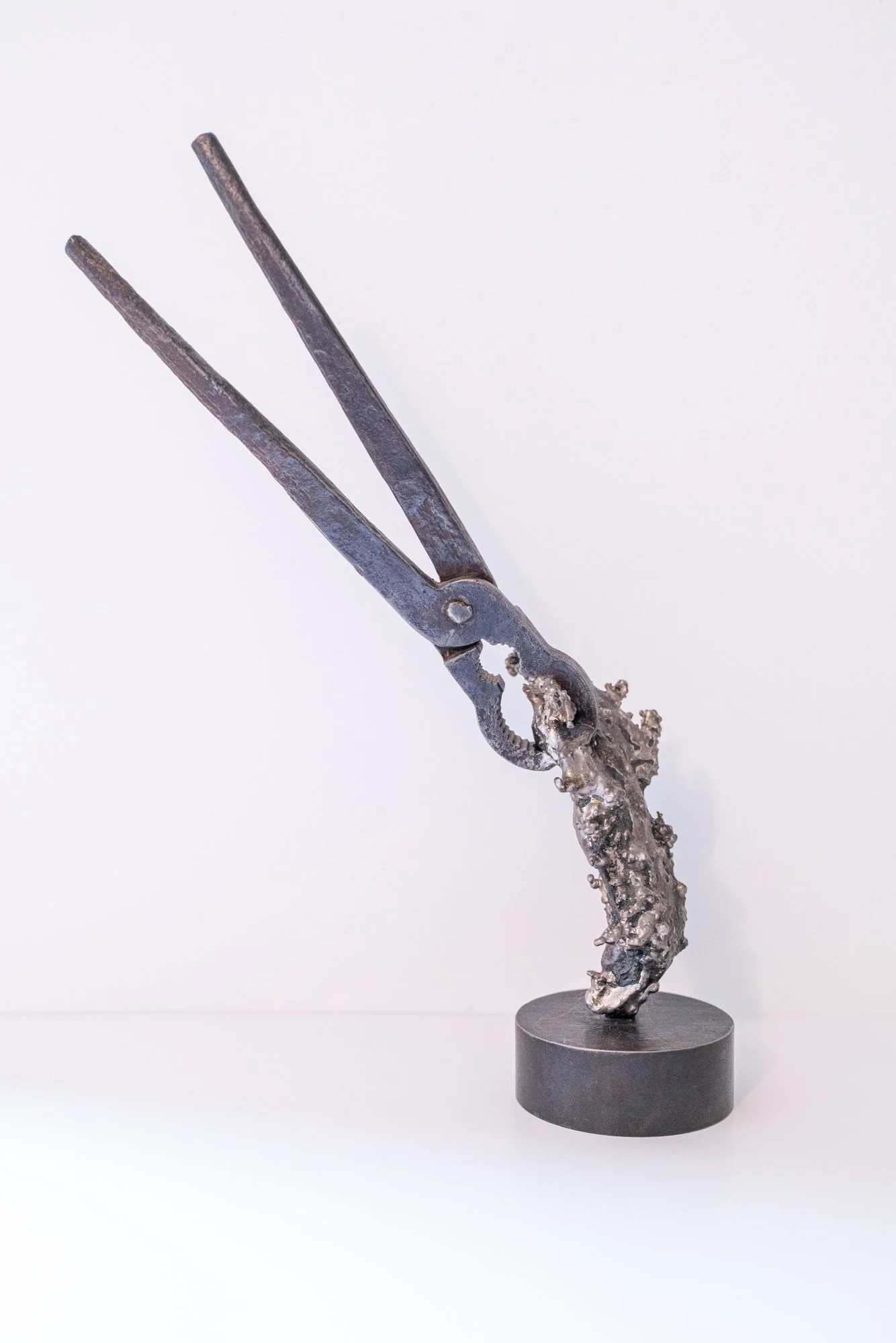 Grab It -Inspired by the instructions and dialog that takes place when working together with another person. Cast stainless steel, vintage nipper tool, welded steel.  2018