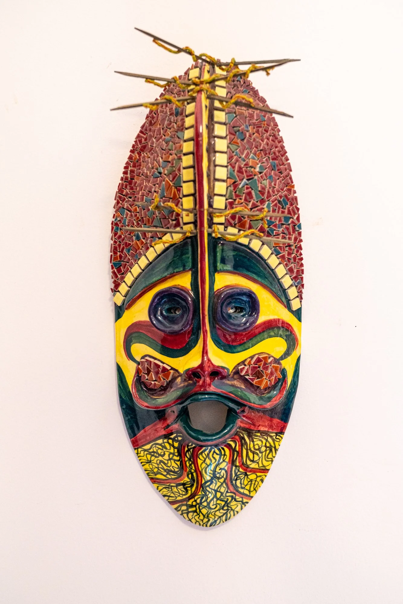 Mosaic Mask - Intuitively modeled. Low fire clay, ceramic tiles, florist picks, wire, beads. 24” x 7.5” x 3” 