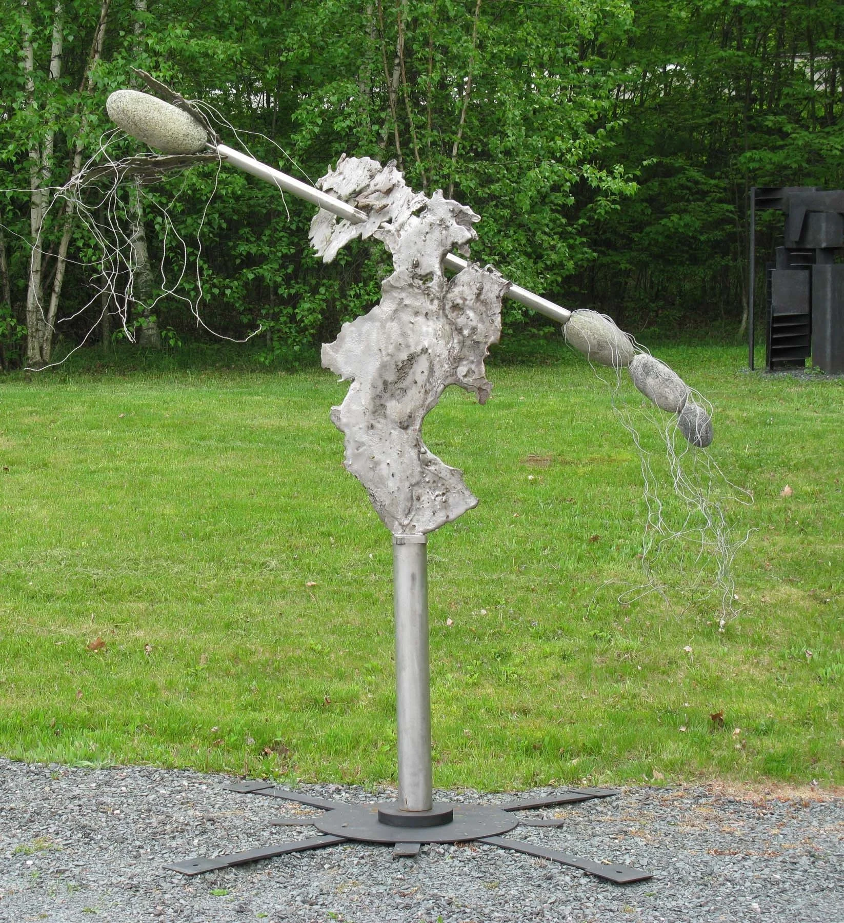 Surge - Inspired by emulating a dramatic forward and upward movement. Cast stainless steel, stainless pipe, stones, aluminum wire. 11’8” x 8’ x 2’. 2008