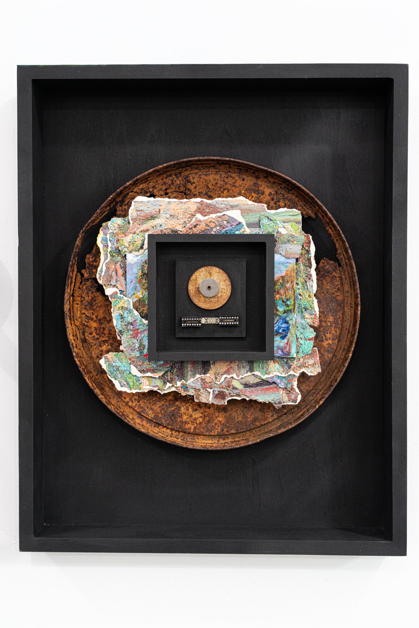 Impact - Inspired by the influence man has on the environment. Wood, rusty can lid, brass,steel, electrical component, encaustic painting, oil painting pieces from a painter friend. 20’ x 16” x 3.5” 2025