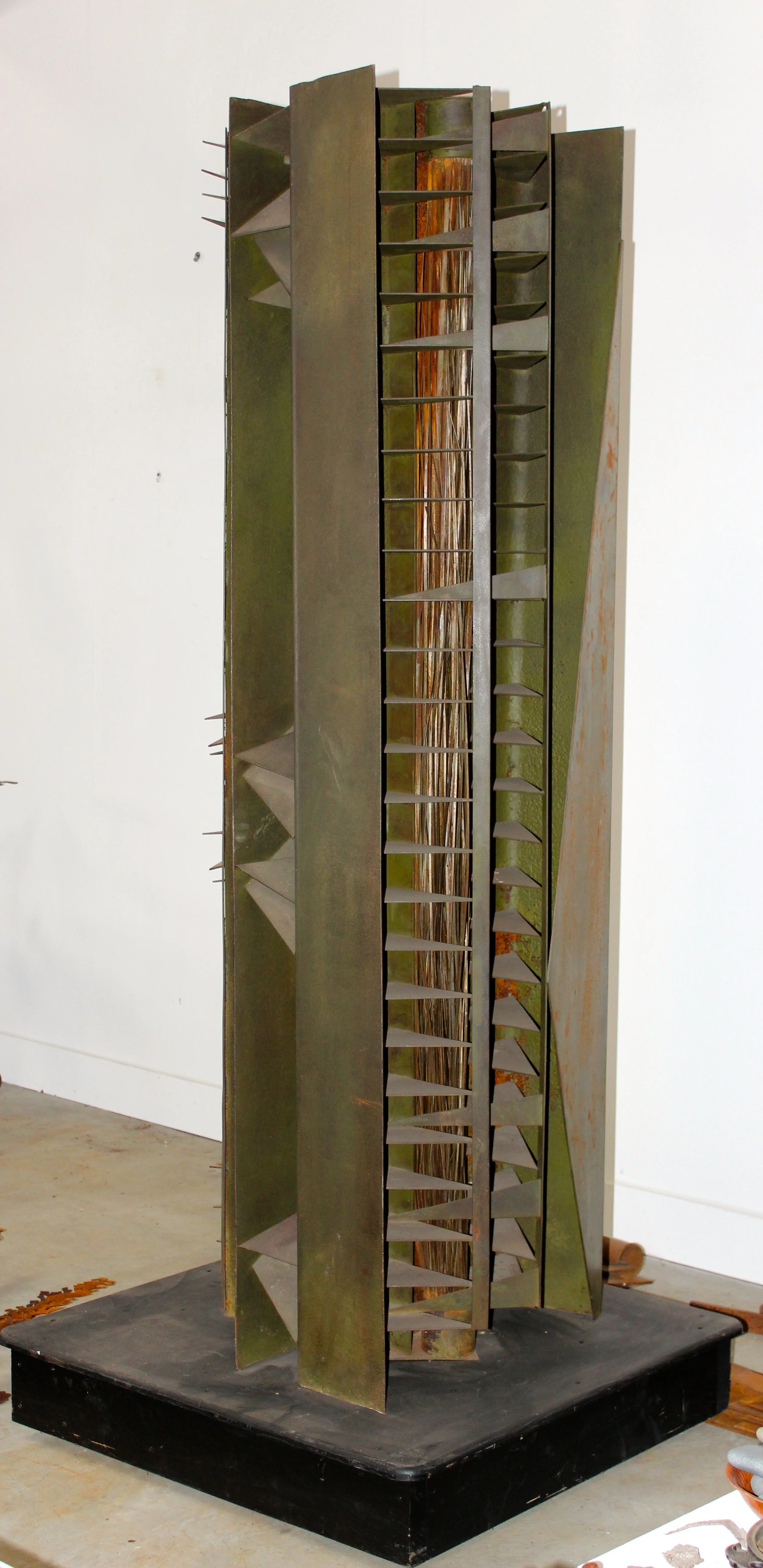 Harvest God - Inspired by the dangers of working with farm machinery. ( A friend lost his hand in a piece of equipment) Welded steel,  78” x 24” x 30”. 1985