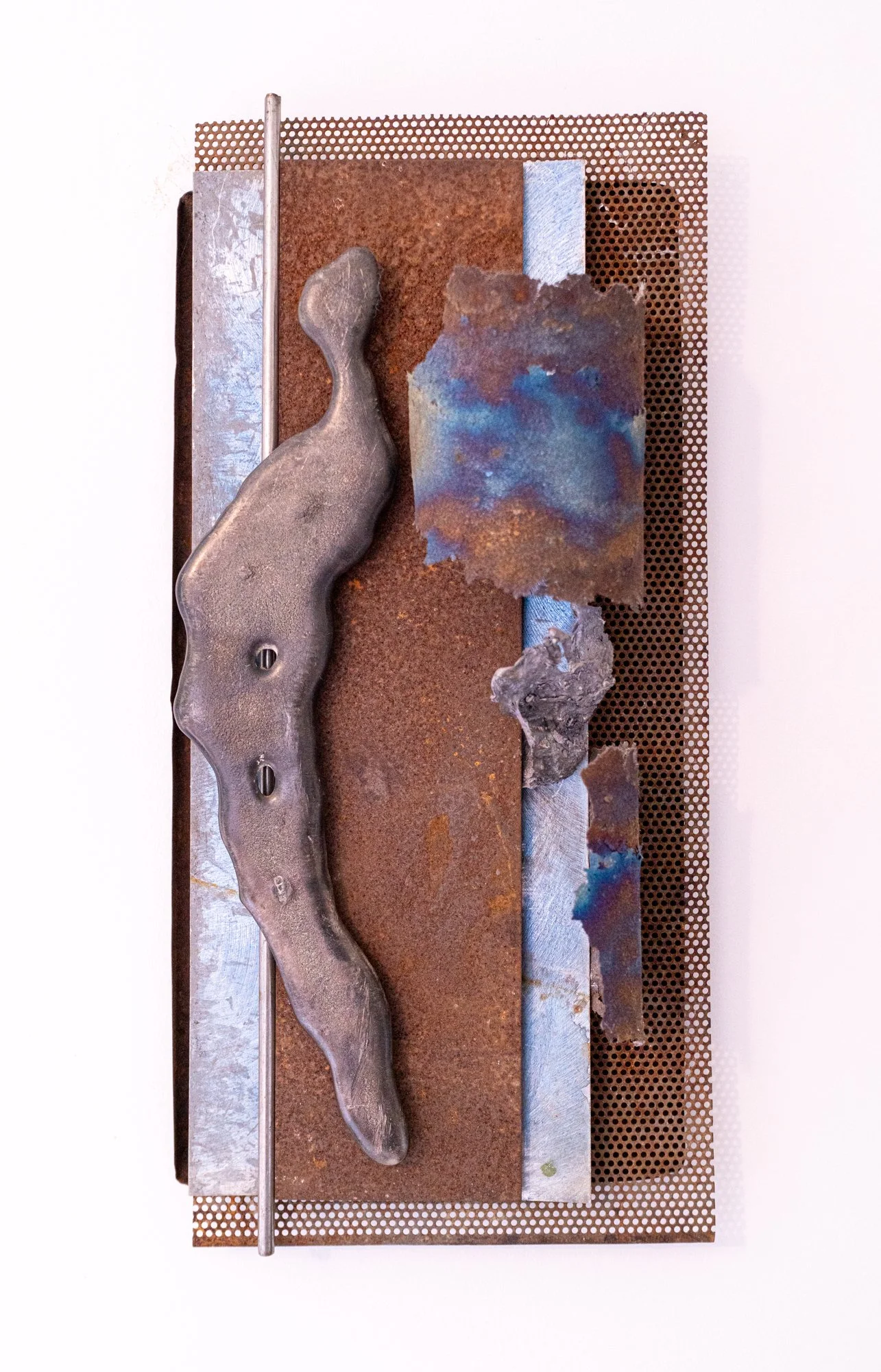 Persuasive Hold - Formal juxtaposition of various objects depicting a forceful influence on the interior space. Welded steel, cast stainless steel, stove pipe liner. 25” x 11” x 5” 2018.