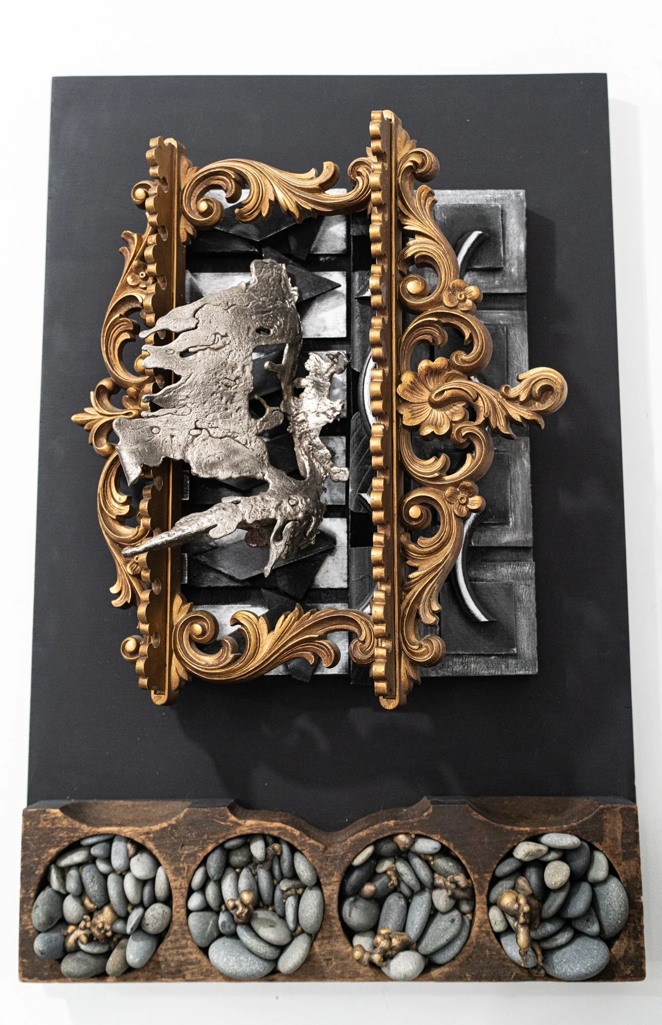 Abundance - Inspired by a state of richness and implying more than enough. Cast stainless steel, wood, stone, gold frame. 24” x 16” x 16”. 2018